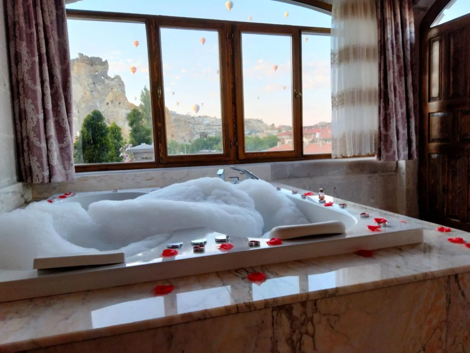 Property building, Bed in Underground Cave Suites Hotel