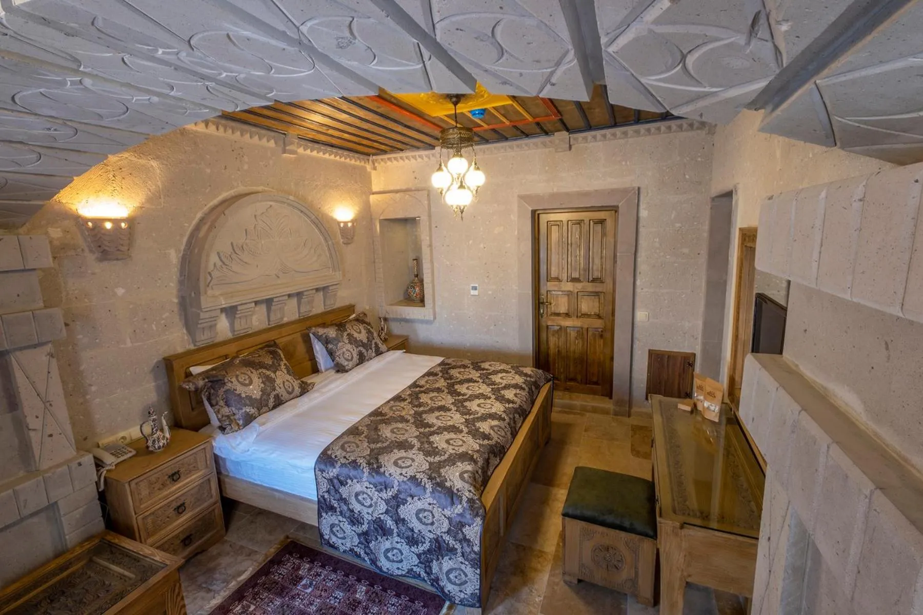 Bed in Underground Cave Suites Hotel