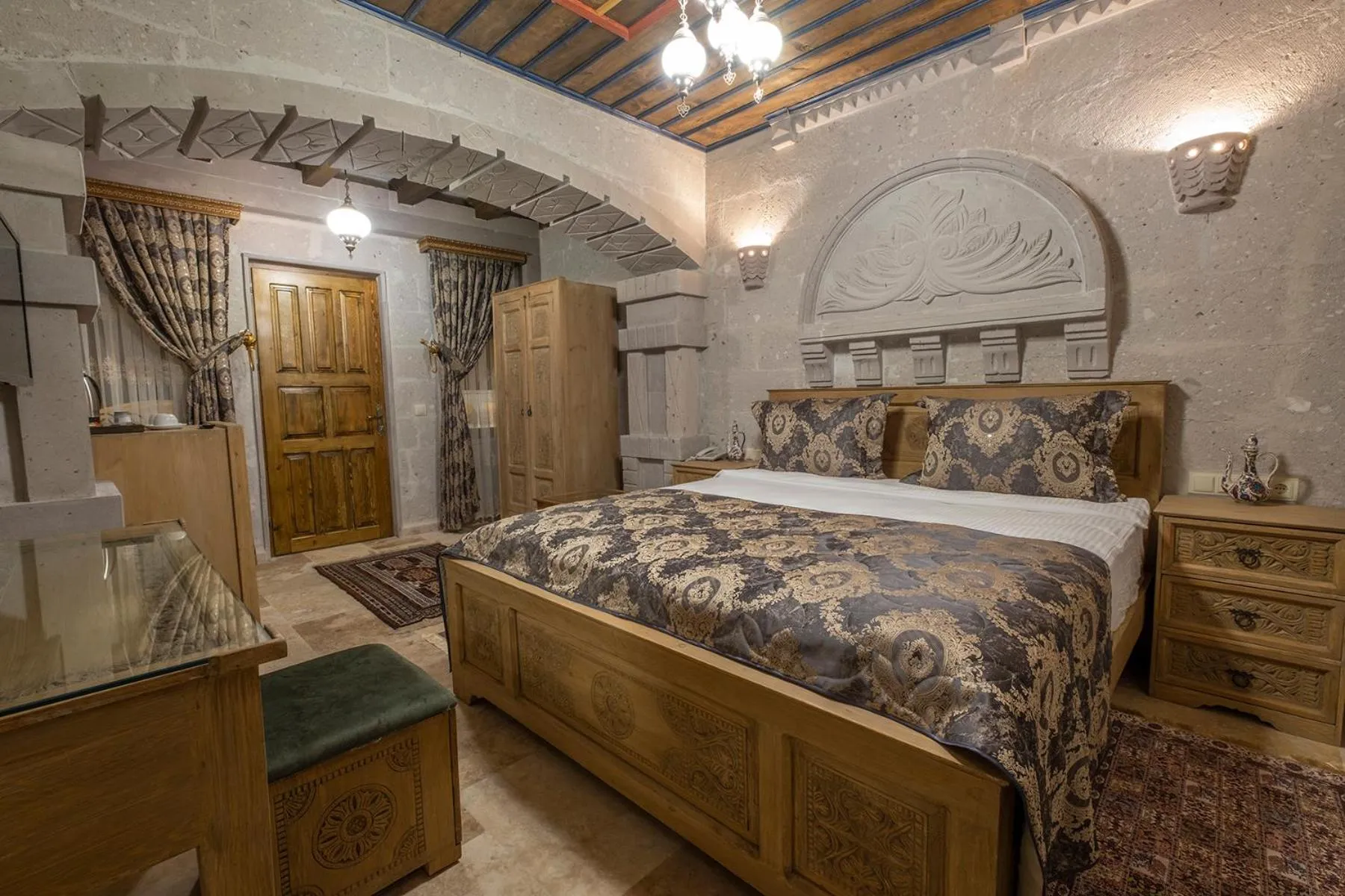 Bed in Underground Cave Suites Hotel