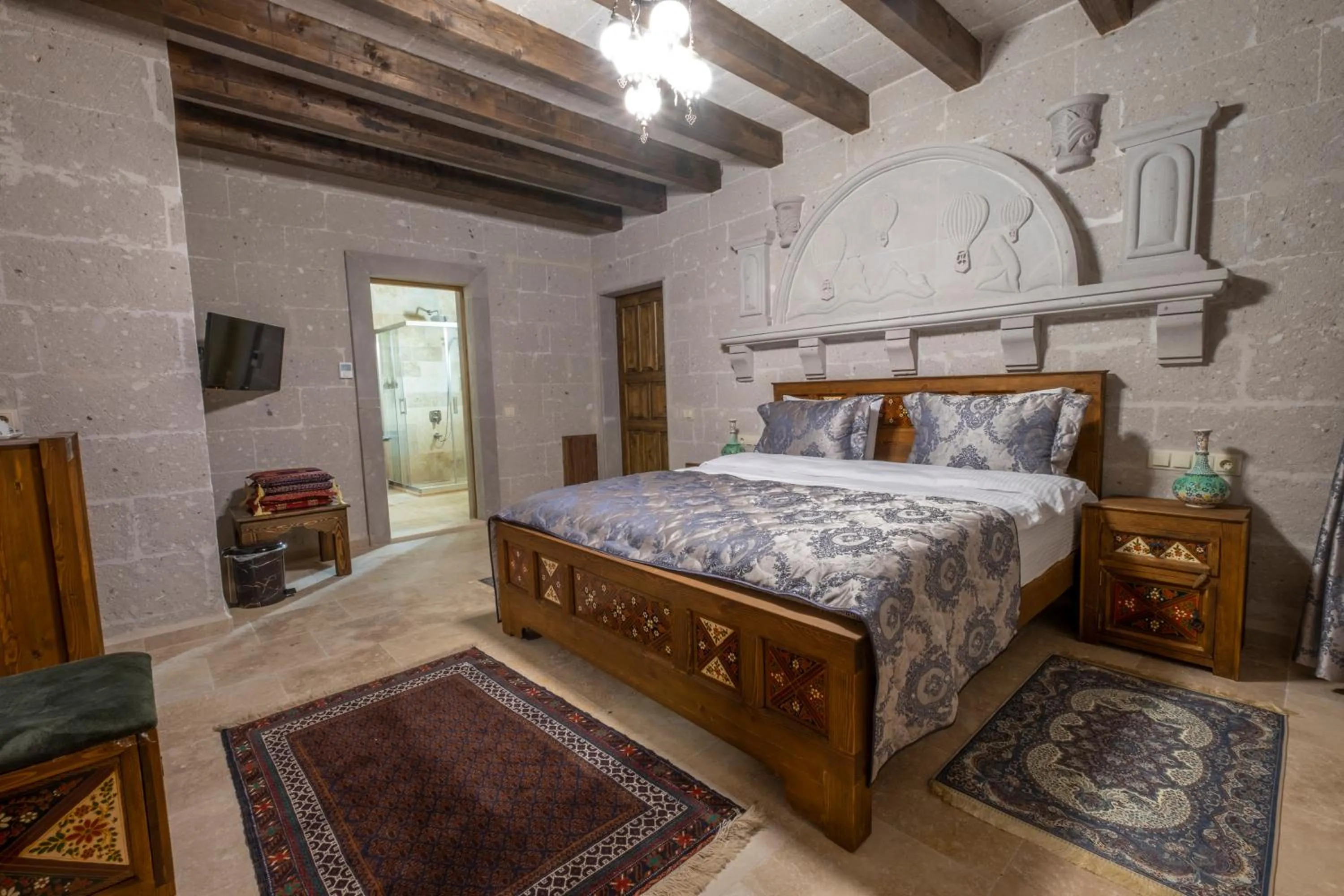 Bed in Underground Cave Suites Hotel