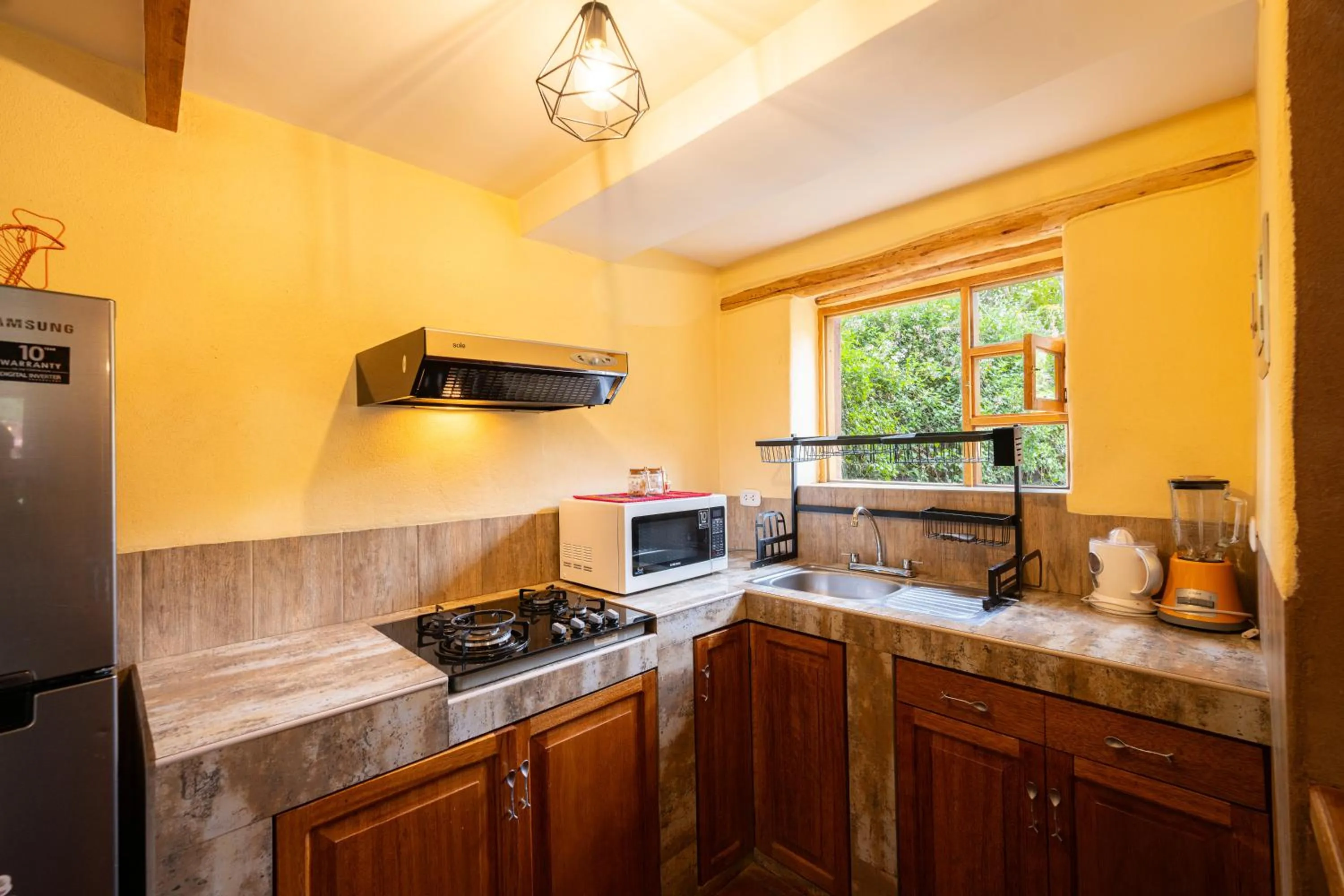 Kitchen or kitchenette in Unuwasi Hotel & Villa