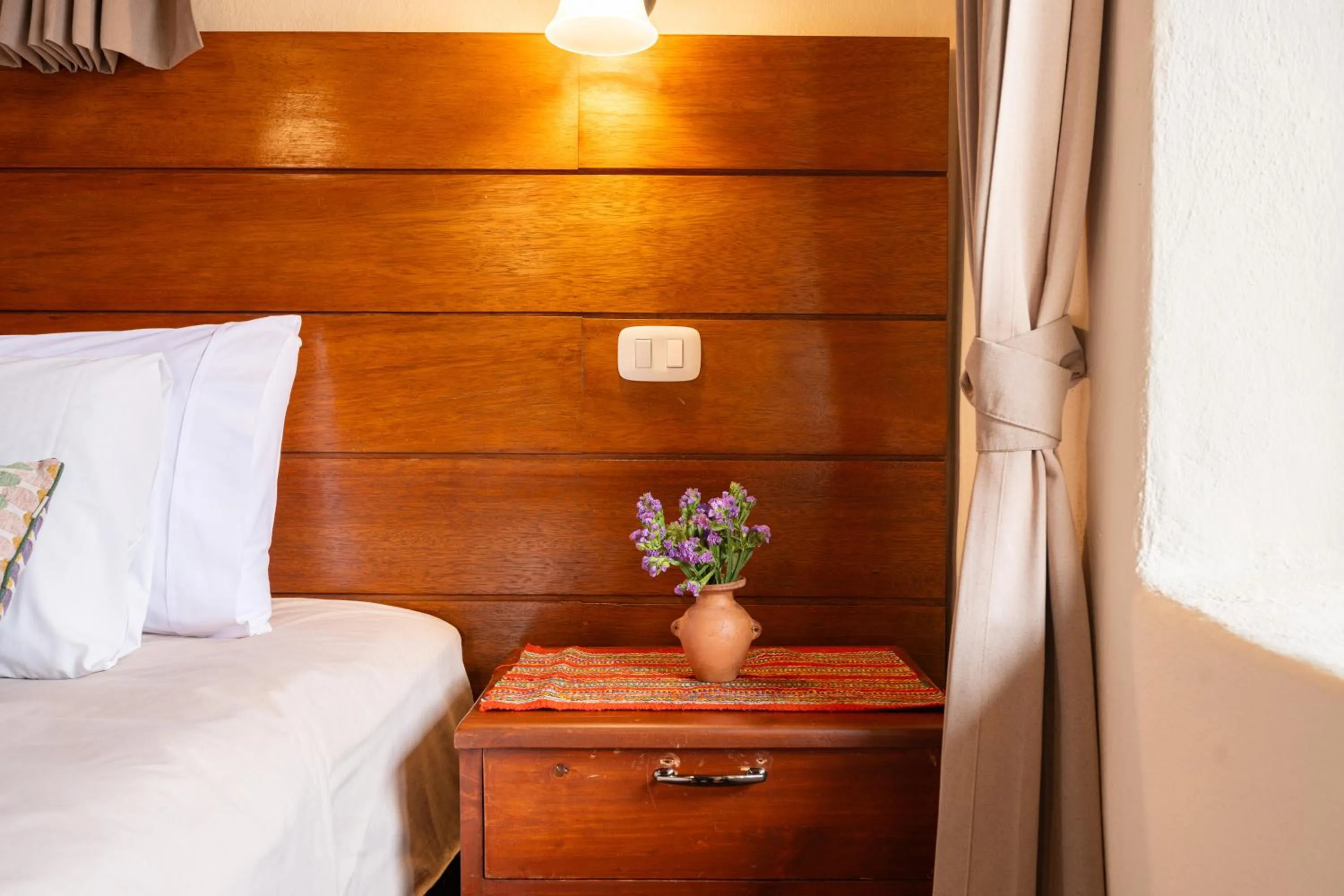 Bed in Unuwasi Hotel & Villa