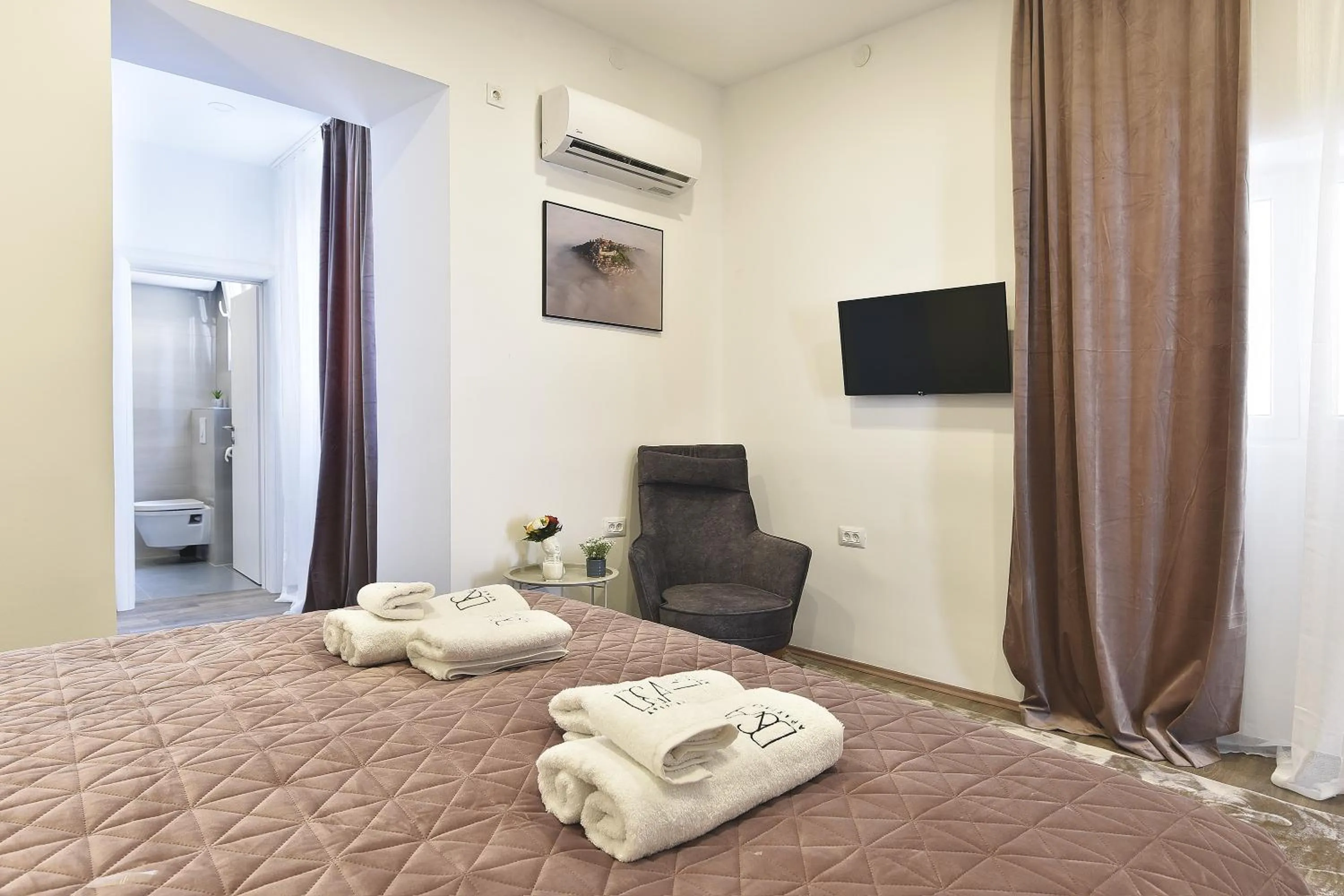 Seating area, Bed in D&A Central Luxury Apartments with FREE Parking