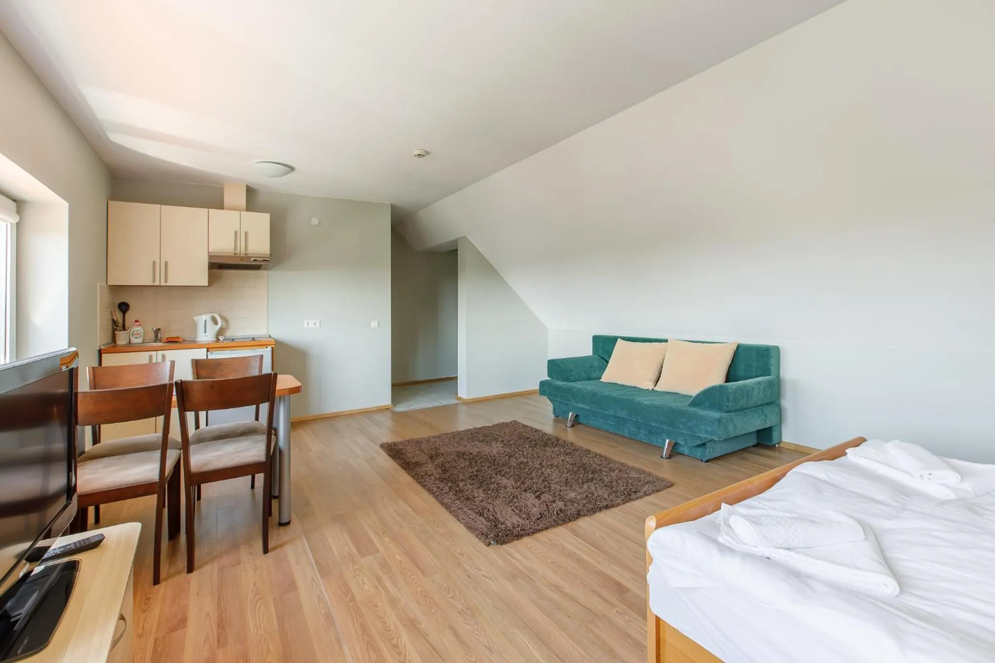 Seating area, Bed in Viešbutis Prie Fontano