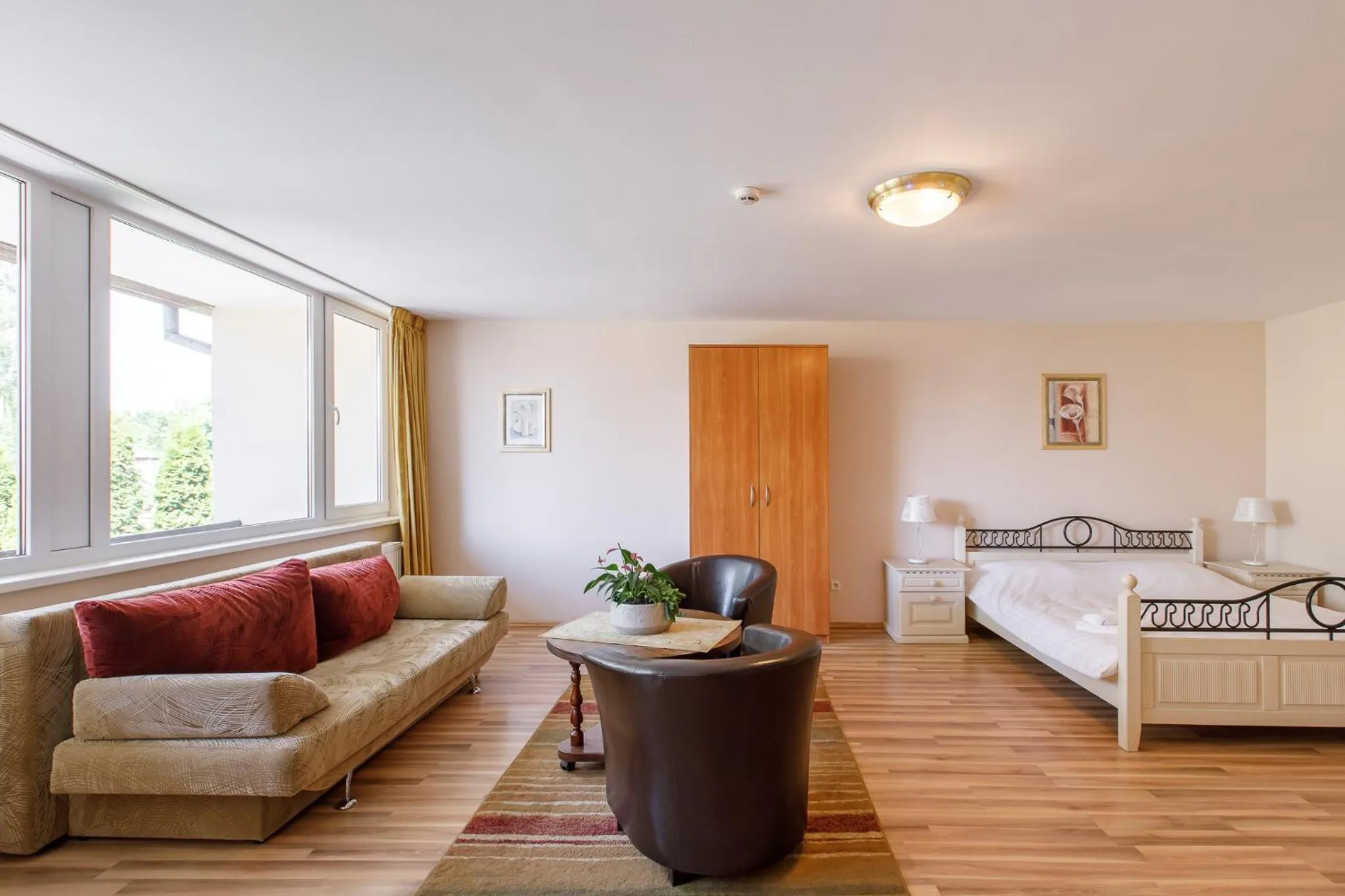 Seating area, Bed in Viešbutis Prie Fontano