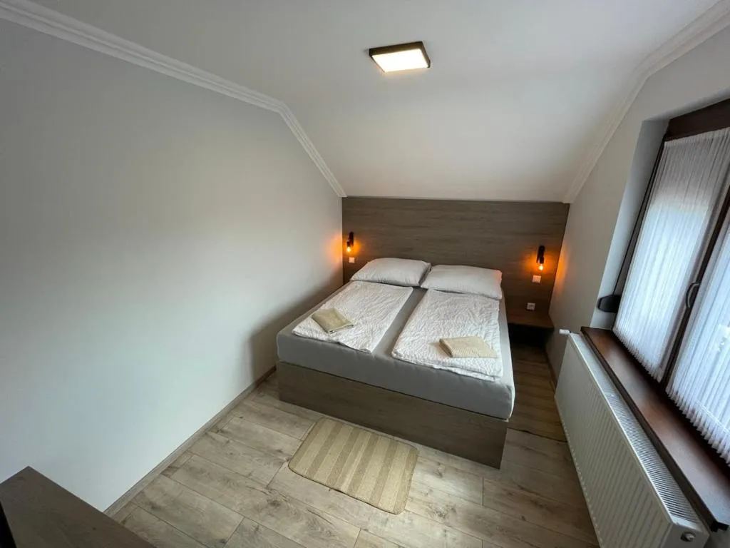 Bed in Kukorica Csárda Apartman