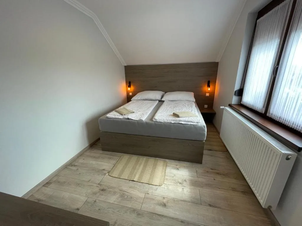 Bed in Kukorica Csárda Apartman