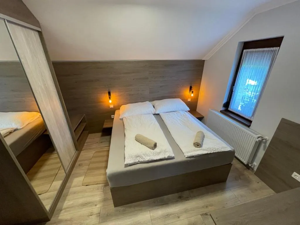 Bed in Kukorica Csárda Apartman