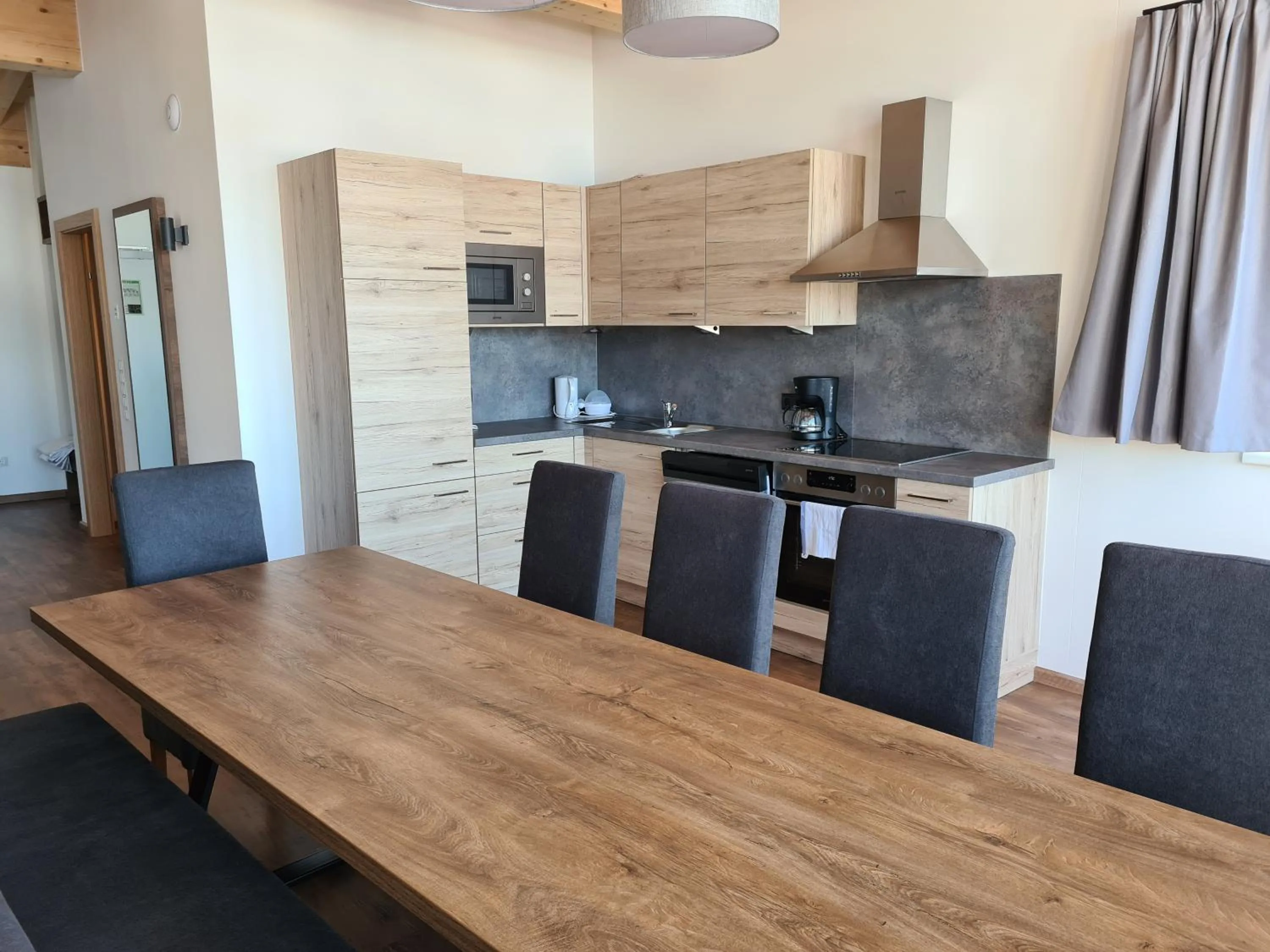 Kitchen or kitchenette in AlpenParks Hotel & Apartment Alpendorf