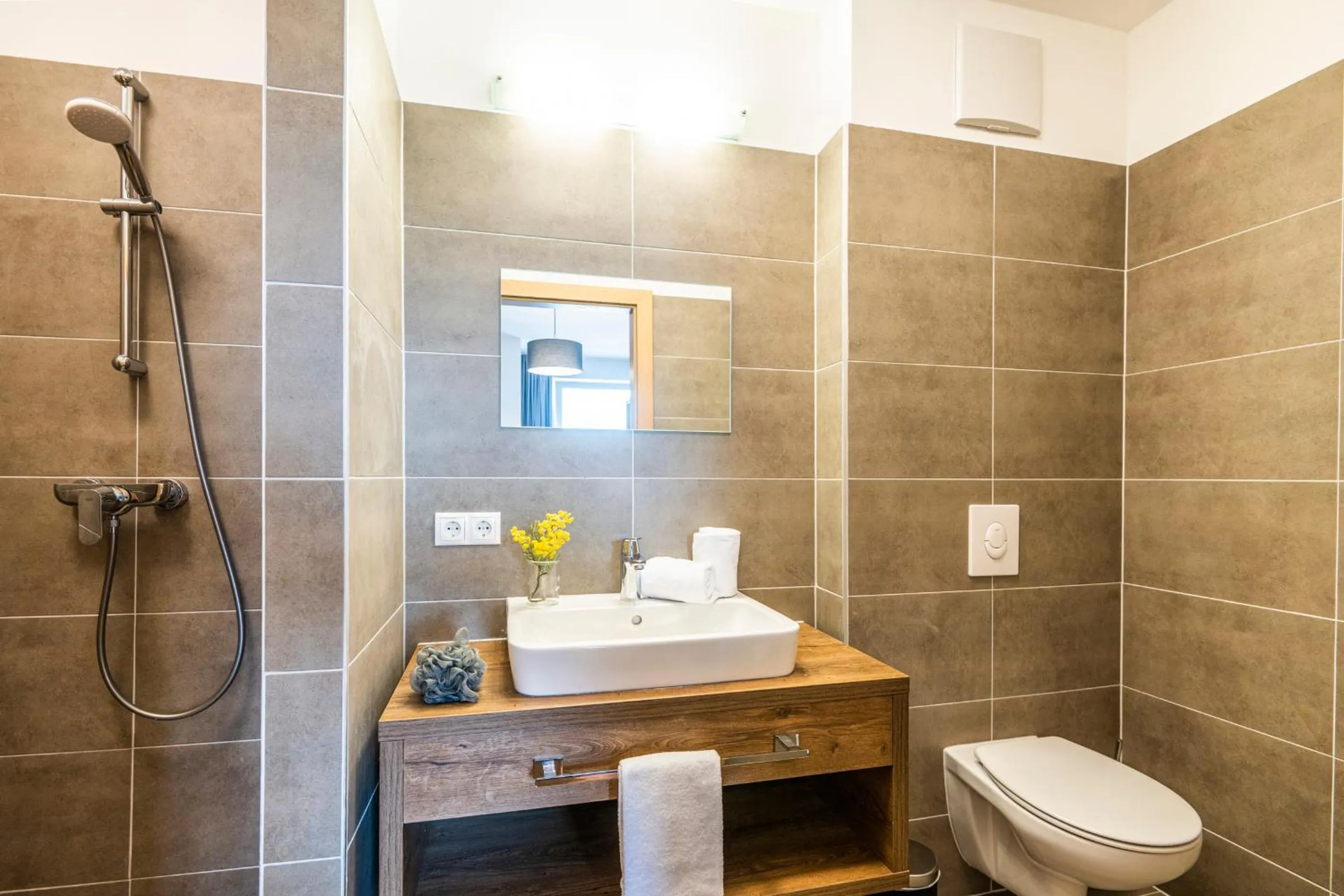 Bathroom in AlpenParks Hotel & Apartment Alpendorf