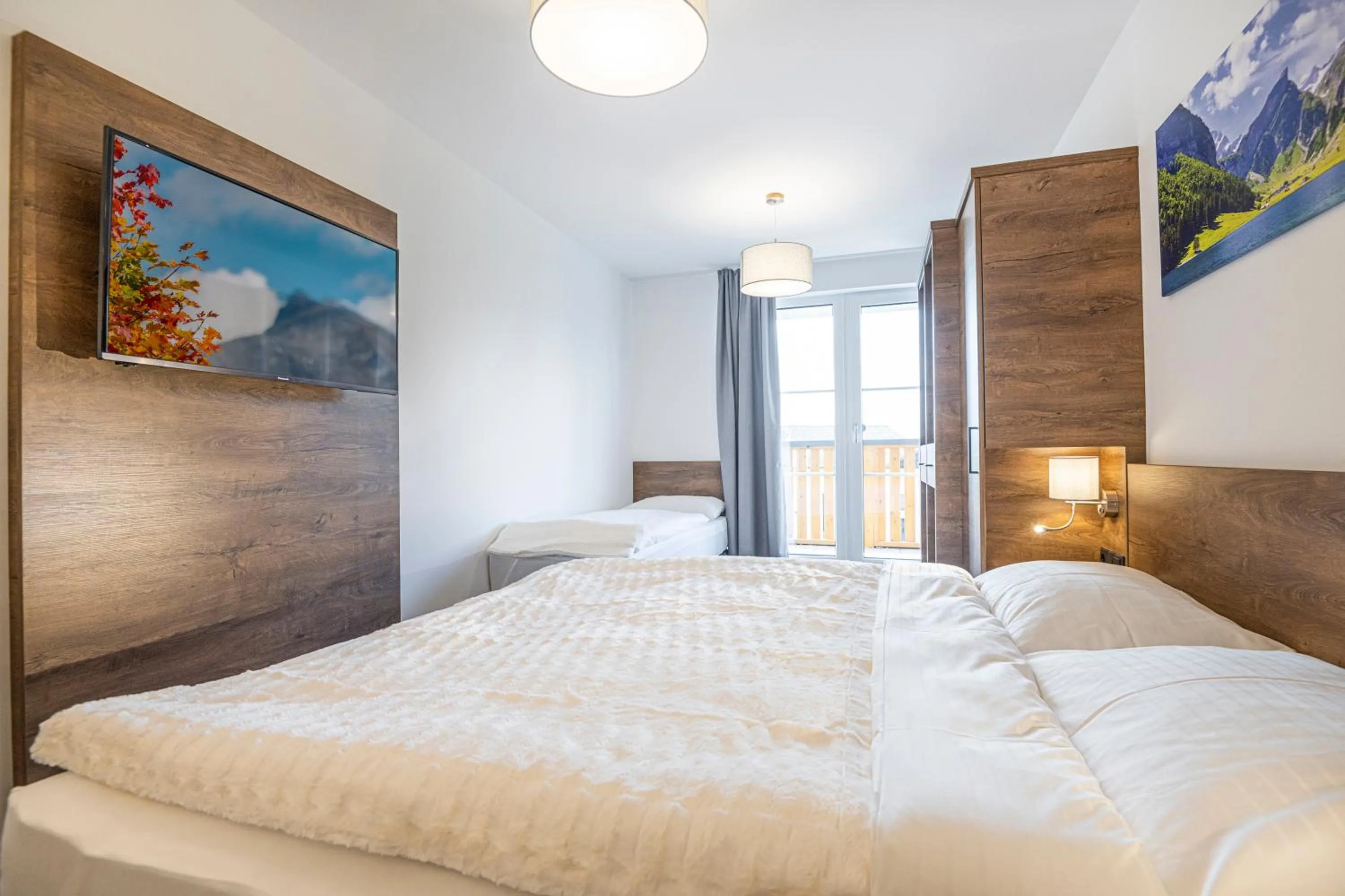 Bedroom, Bed in AlpenParks Hotel & Apartment Alpendorf