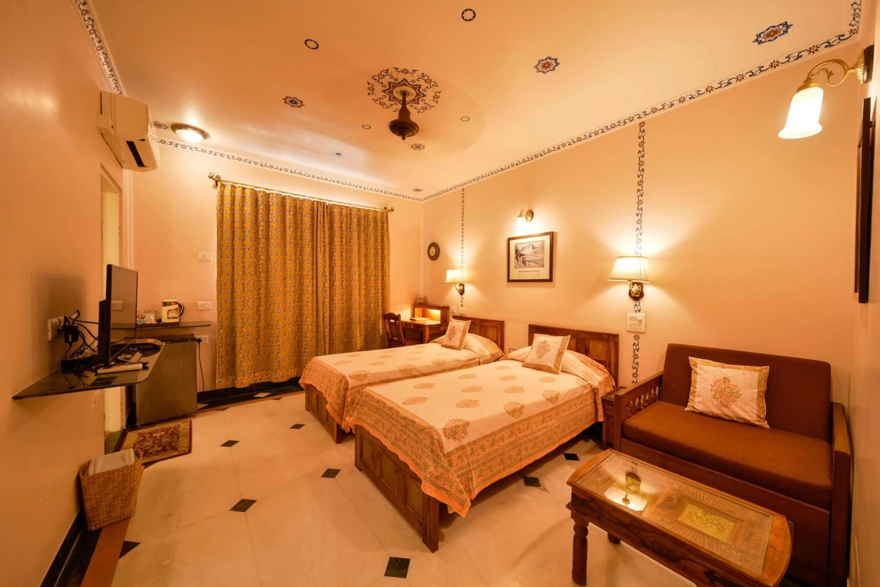 Seating area, Bed in Hotel Arya Niwas