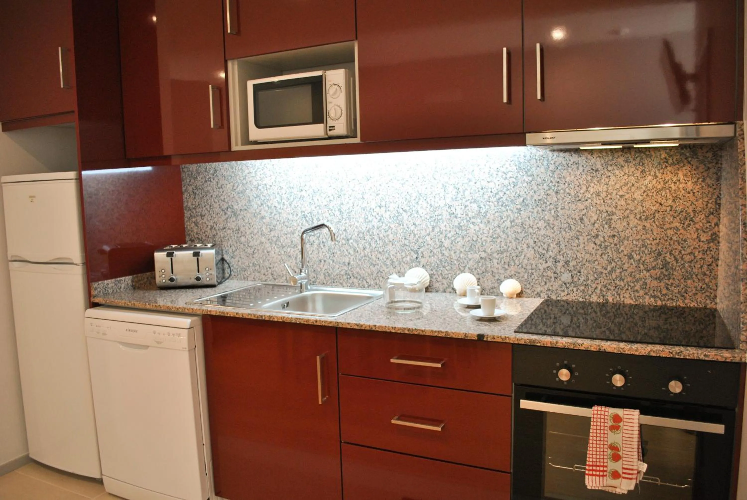 Kitchen or kitchenette in Apartamentos Portodouro - Santa Catarina