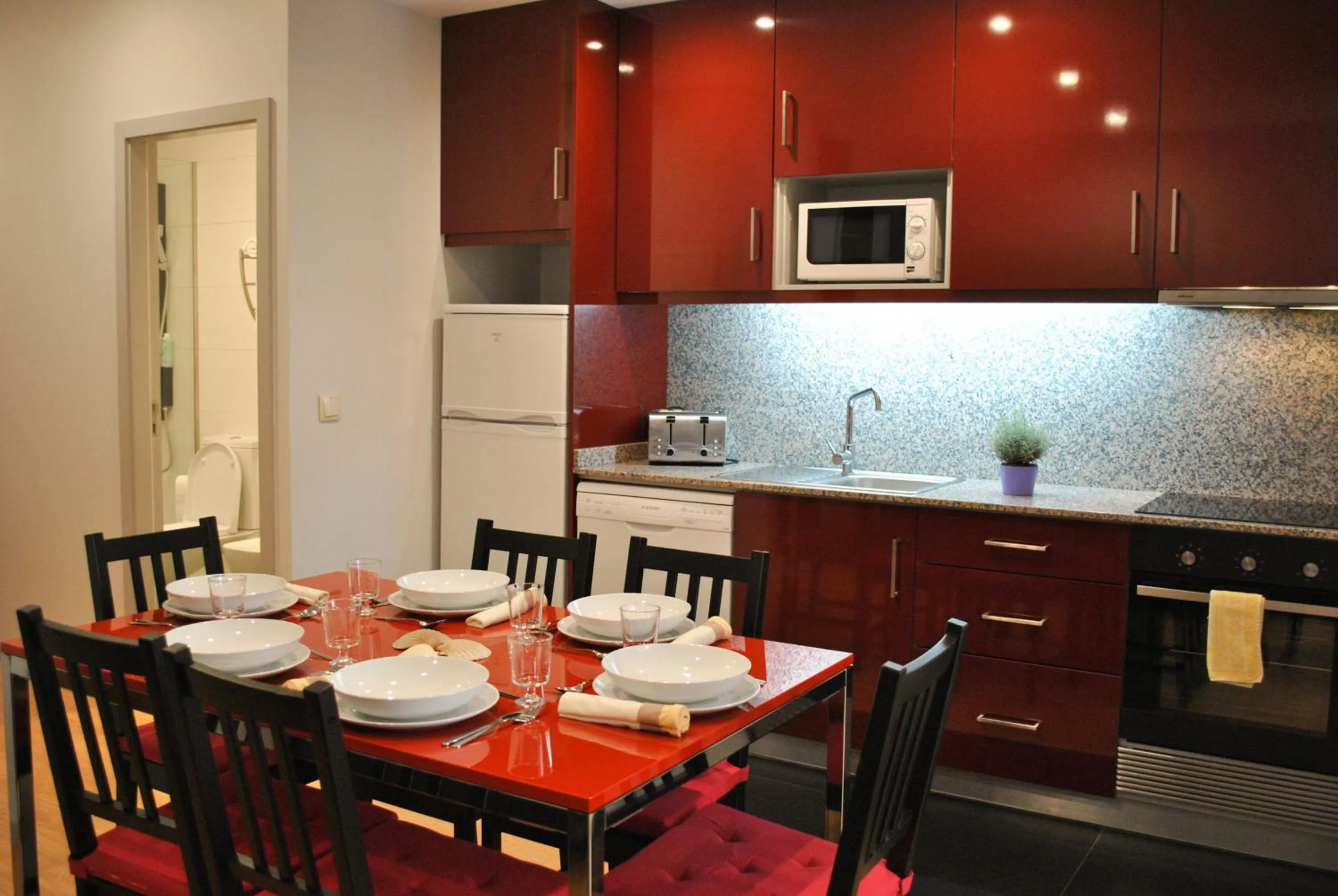 Kitchen or kitchenette in Apartamentos Portodouro - Santa Catarina