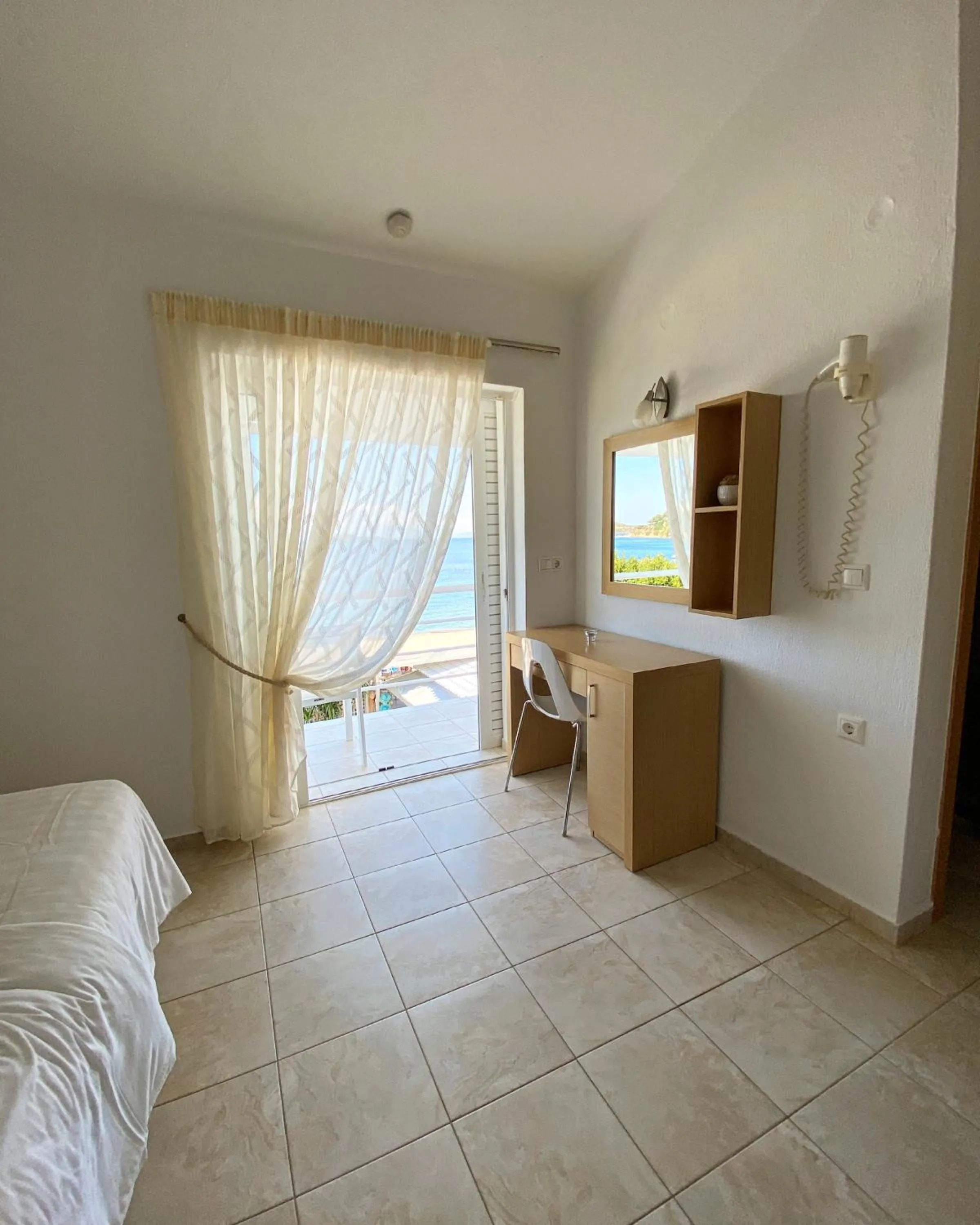 Bed in Anemoni Beach Hotel