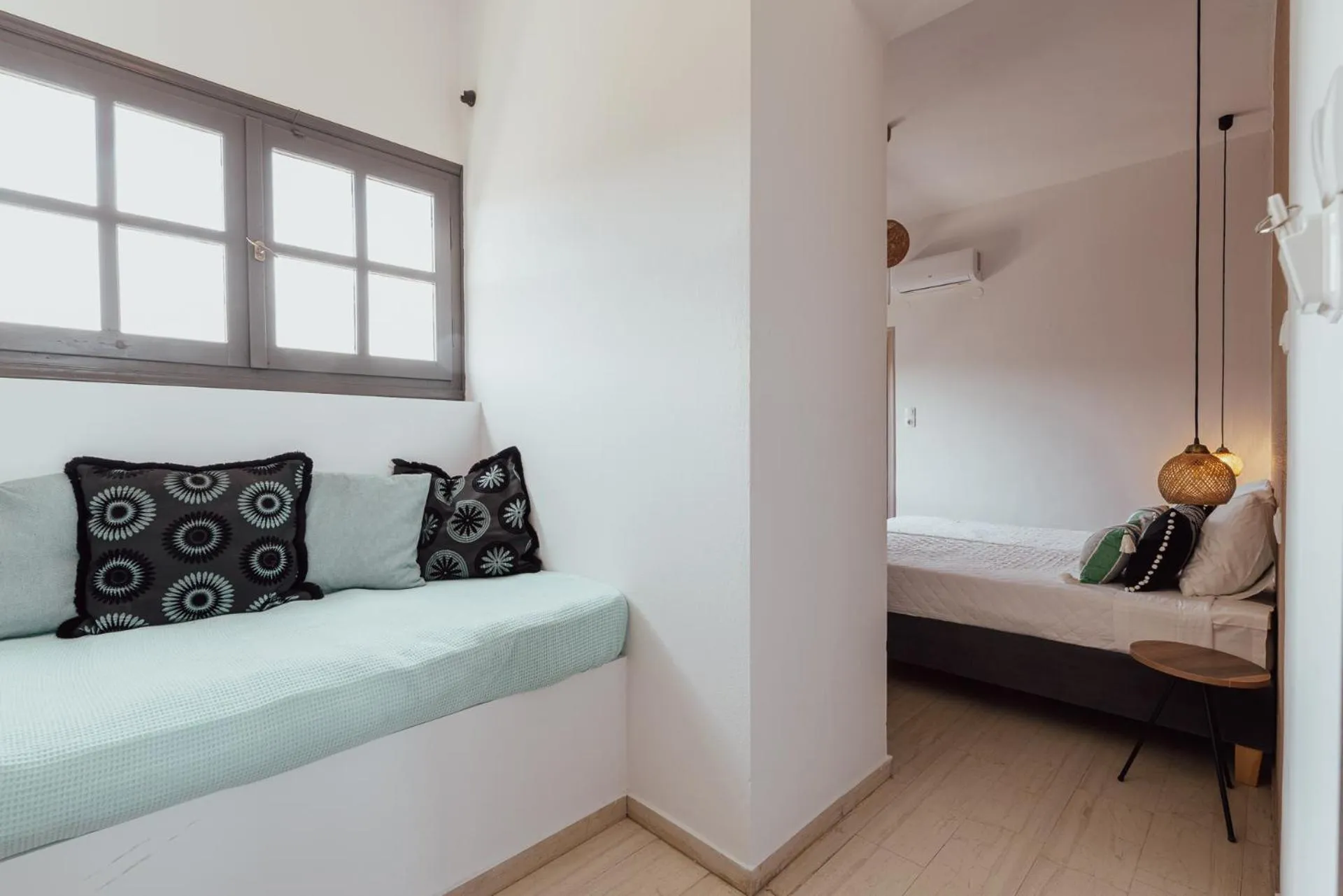 Bed in Anemos Inn by Estia