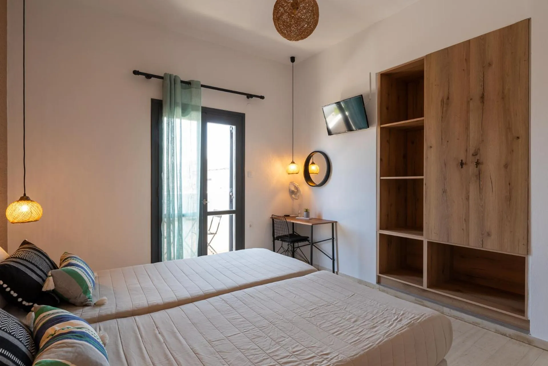 Bed in Anemos Inn by Estia