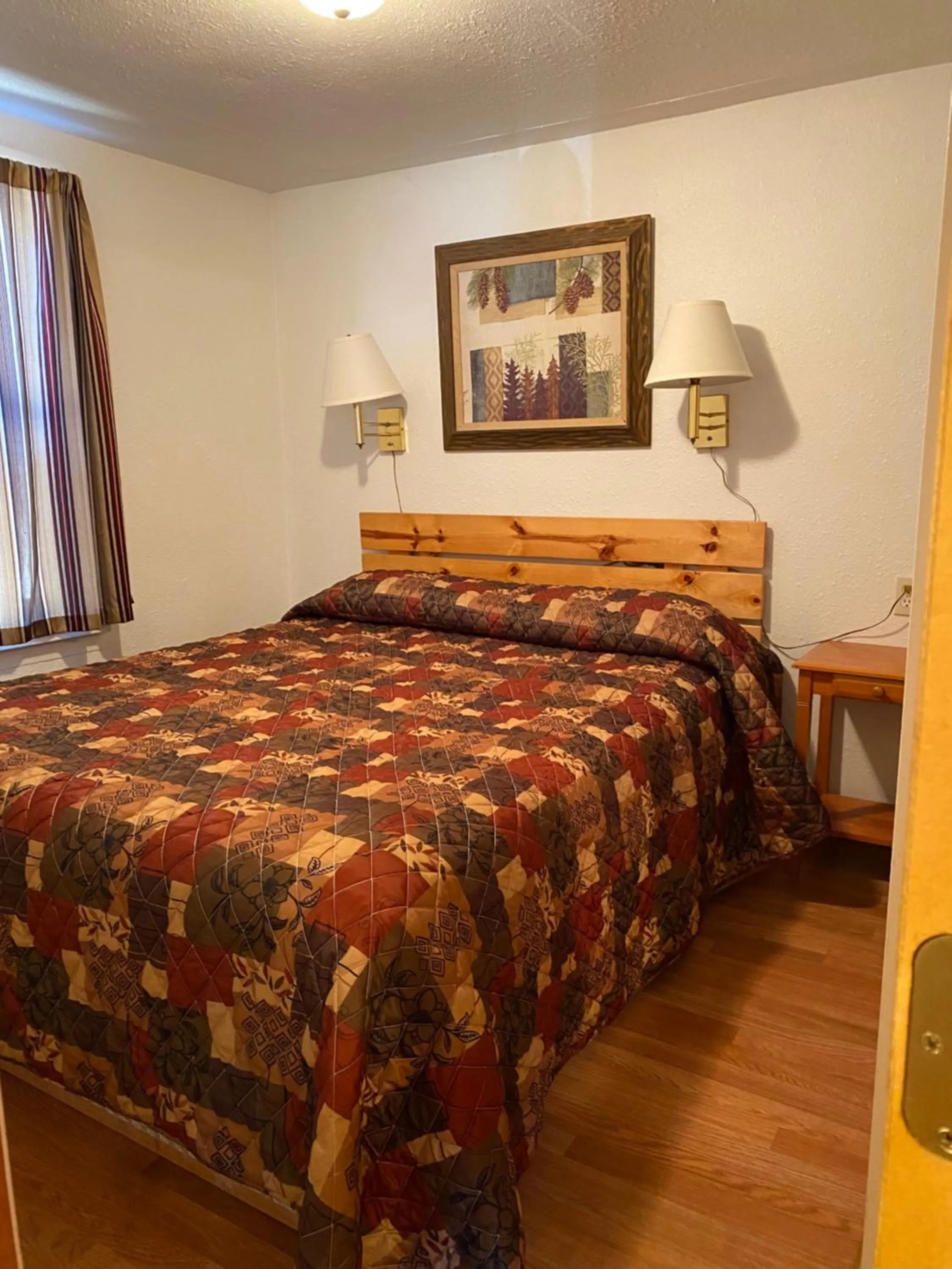 Bed in Oceanside Ocean Front Cabins
