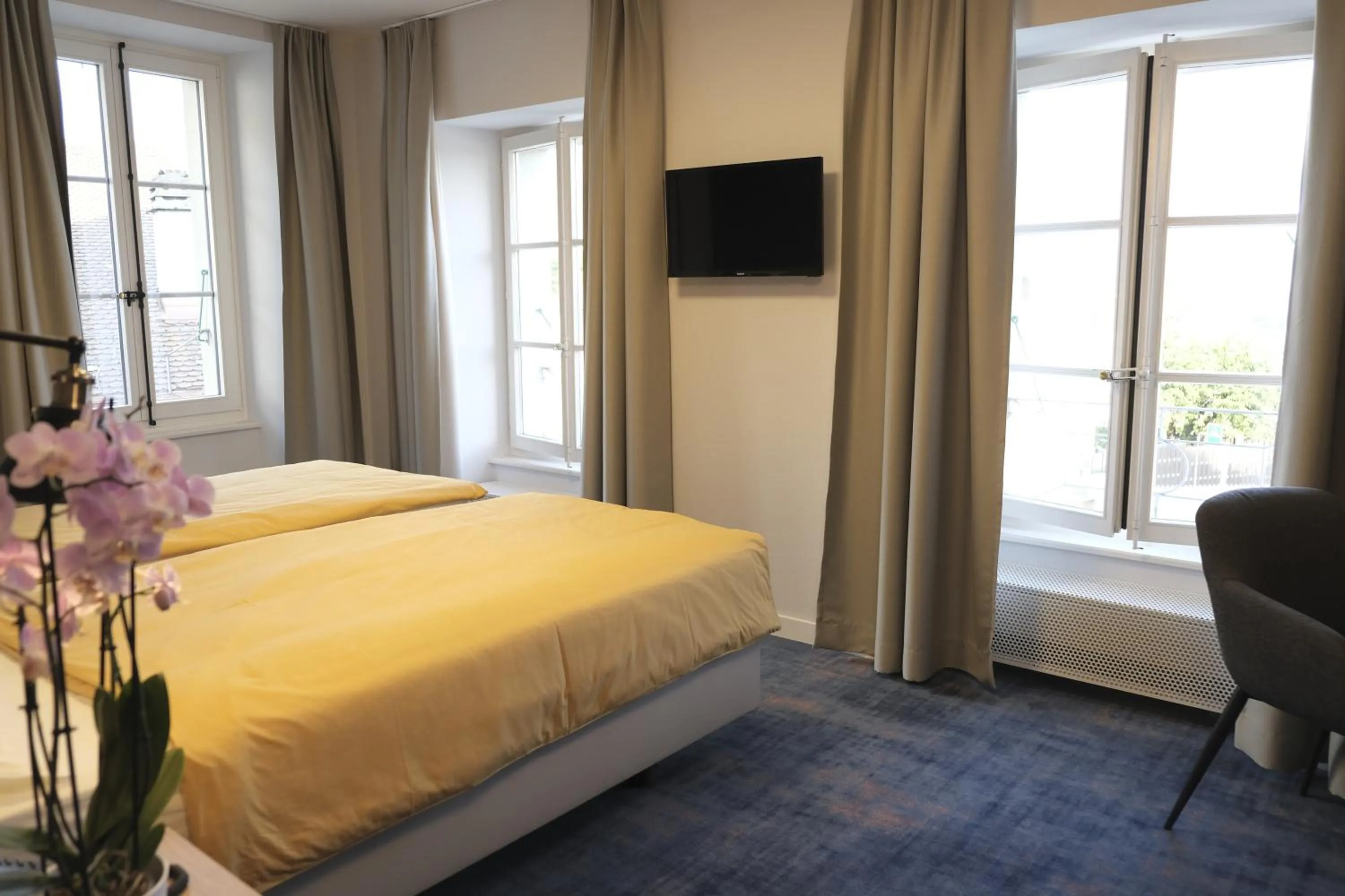 Bed in Boutique Hôtel de l'Ecu Vaudois