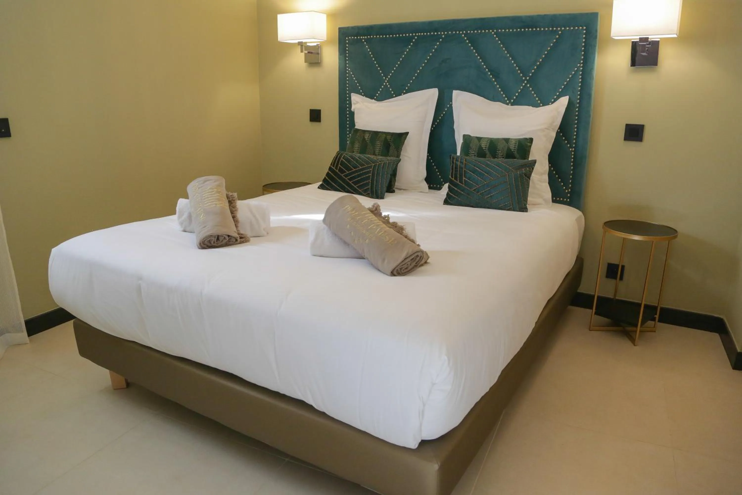 Bed in Eco-Résidence Dolce Paese & Spa