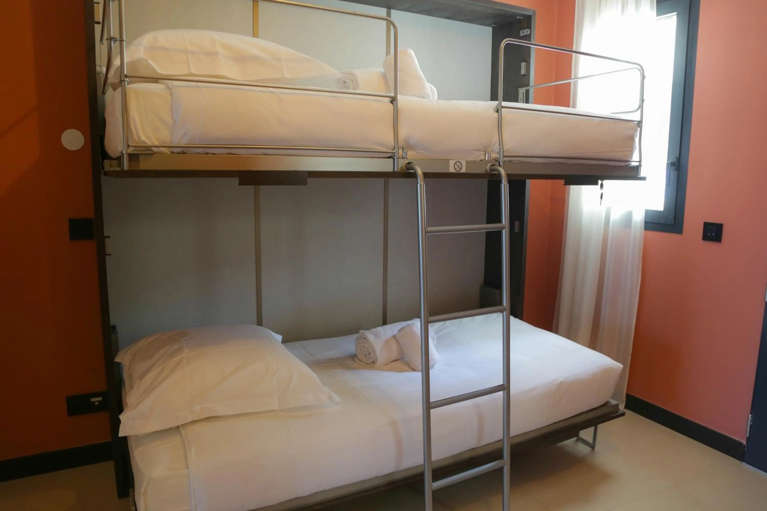 Bed in Eco-Résidence Dolce Paese & Spa