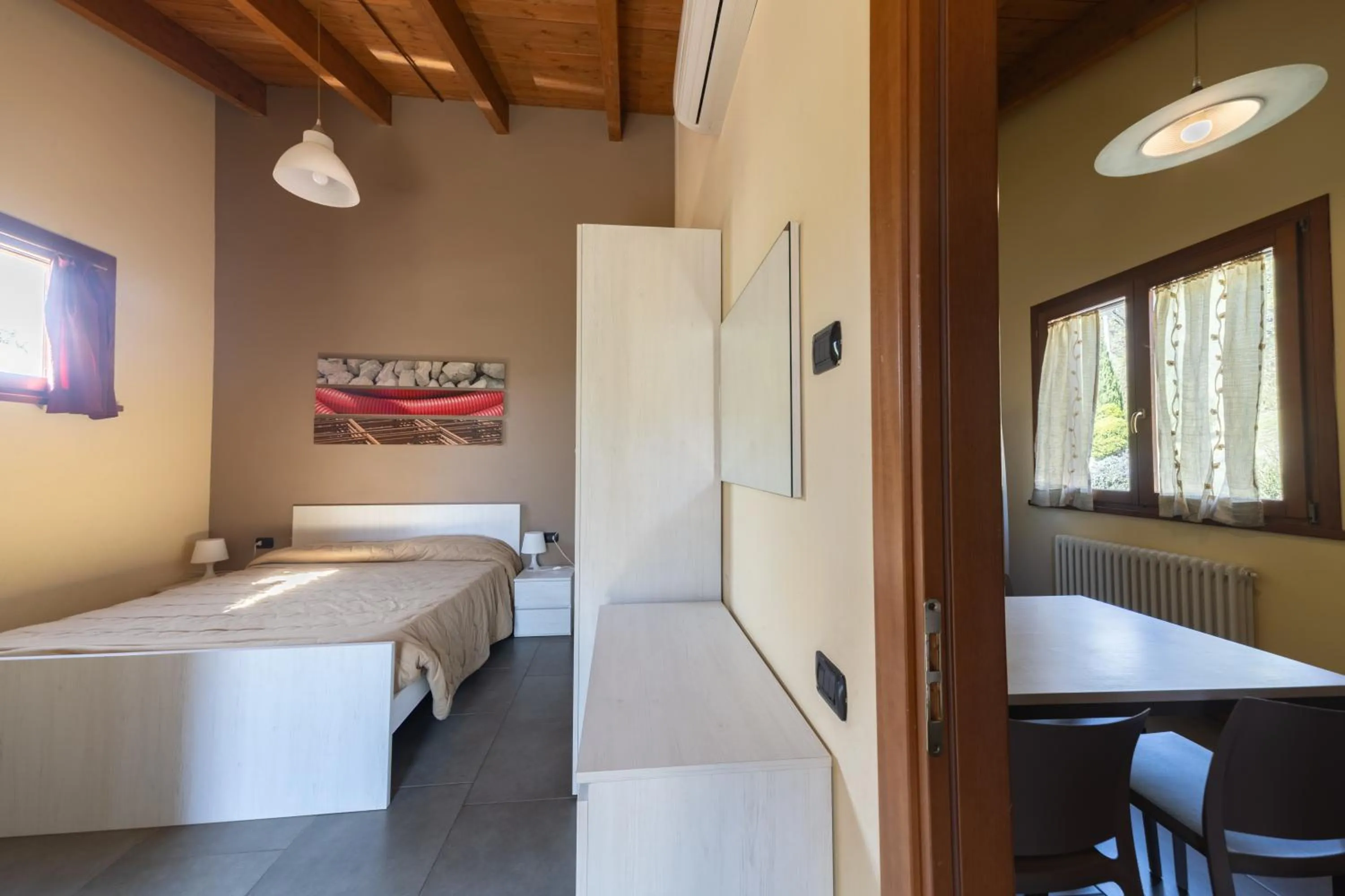 Bedroom, Bed in La Valle Dei Caprioli Village Bungalow Park - Freelandia Azienda Agricola