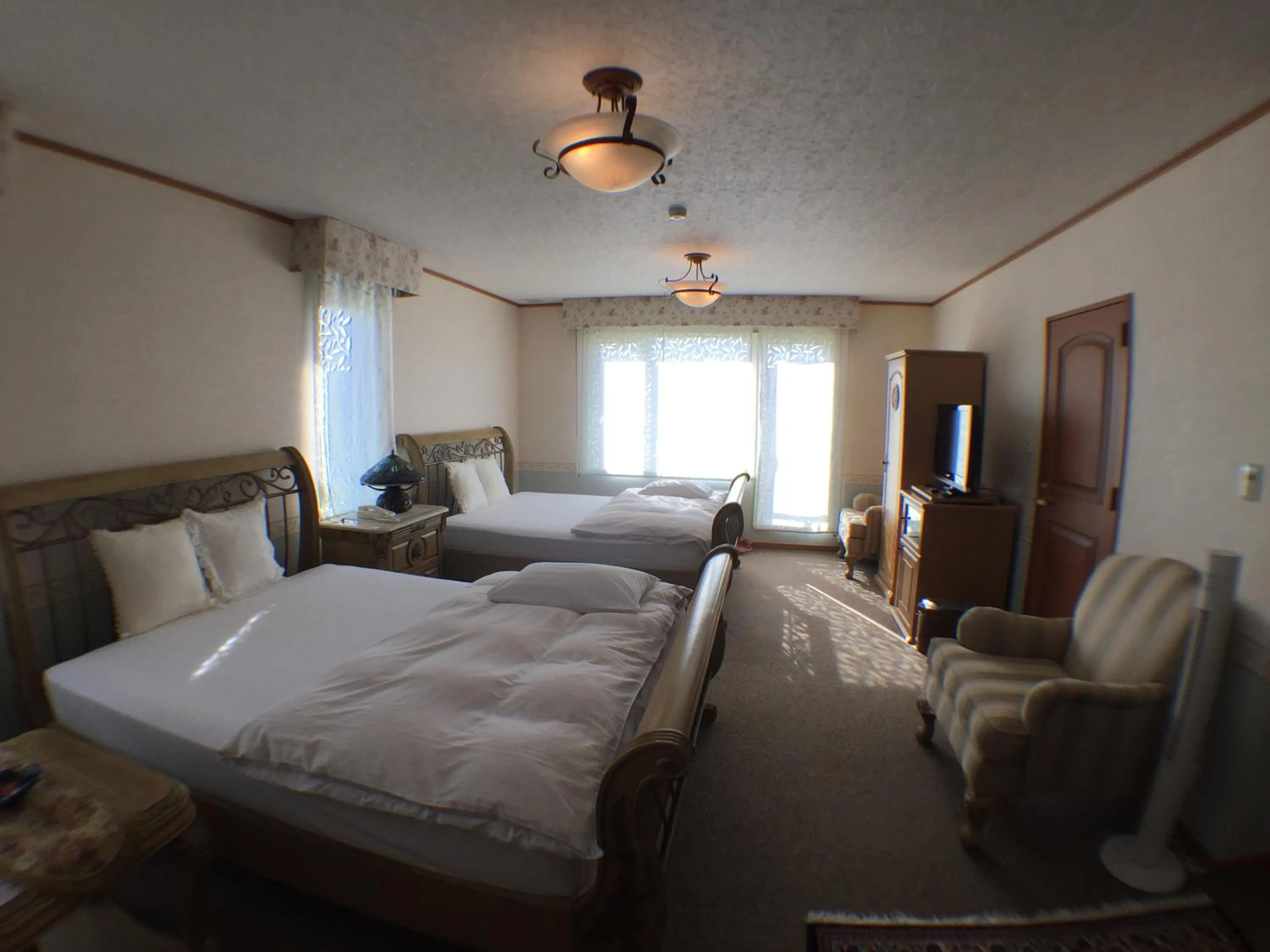 Bedroom in Petit Hotel Corinthian