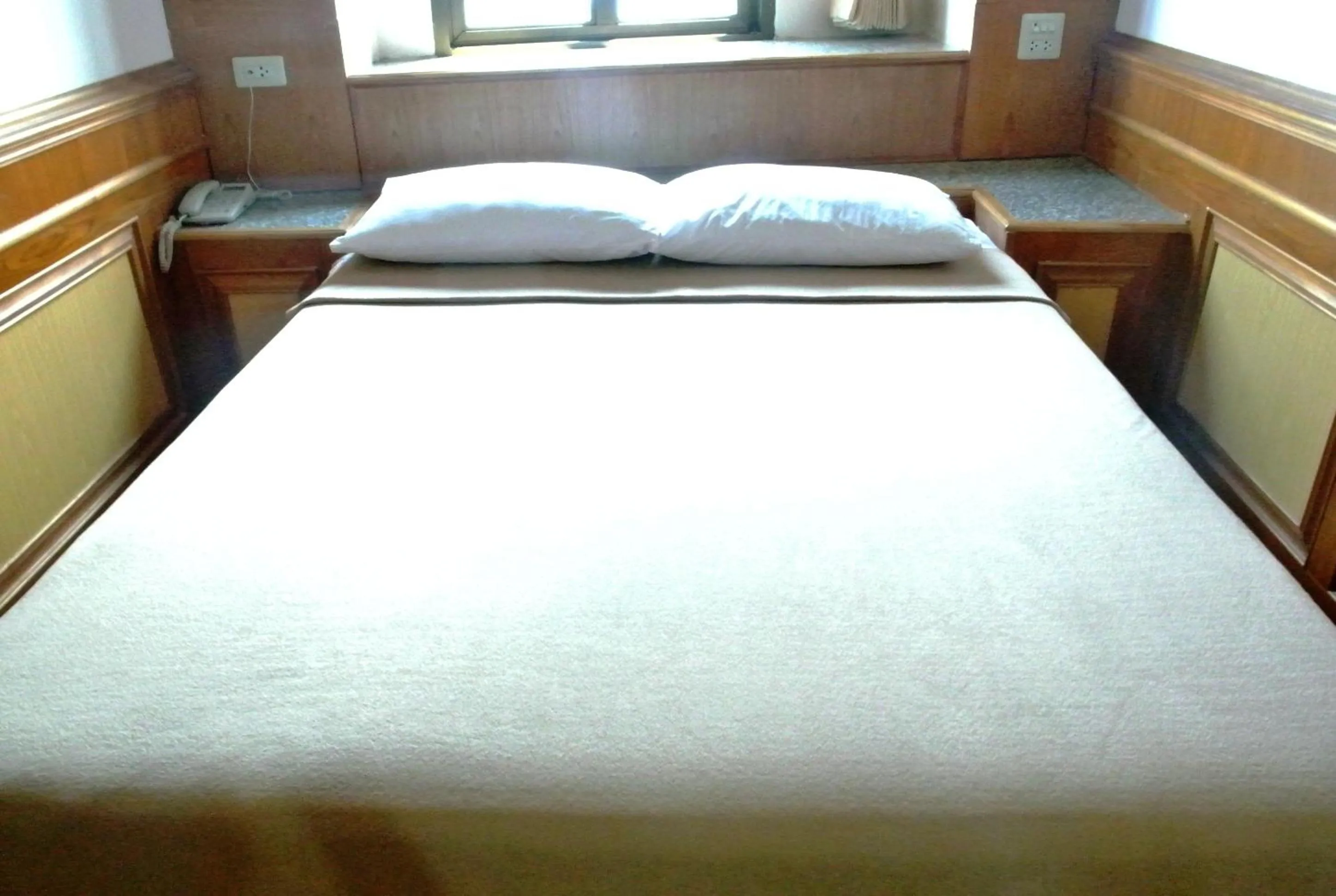 Bed in Rose Garden Hotel