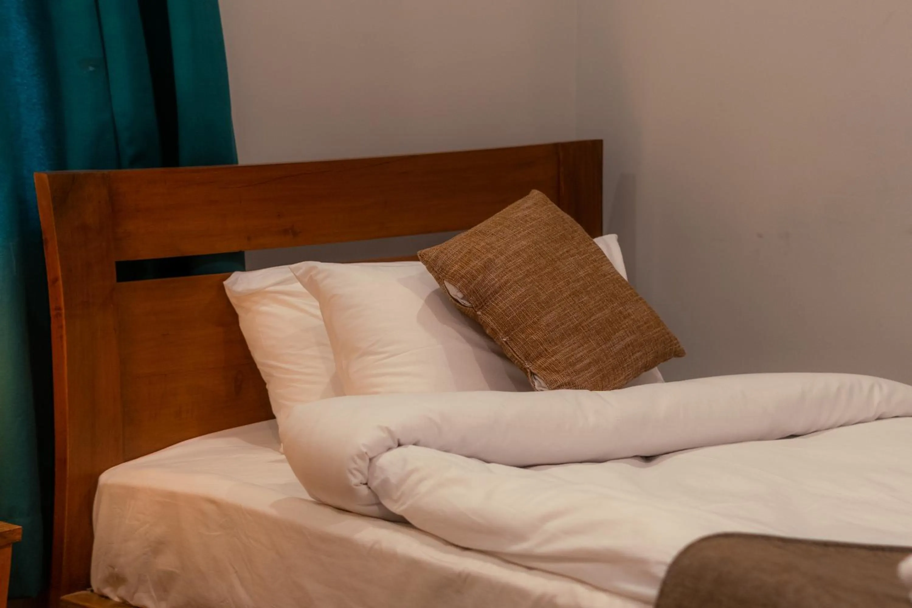 Bed in Dynasty Hotel Skardu