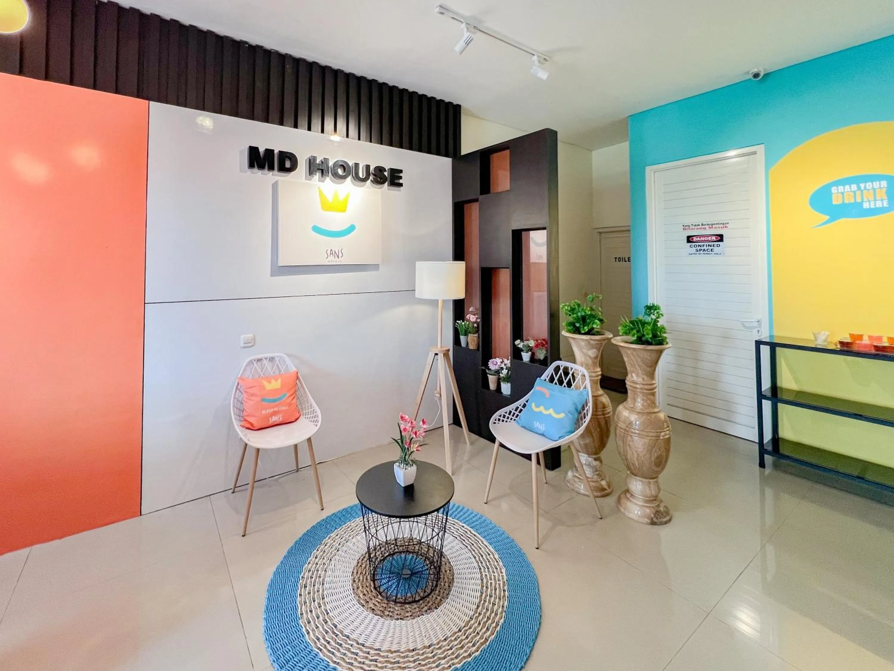 Seating area in Sans Stay Bukit Palma Citraland