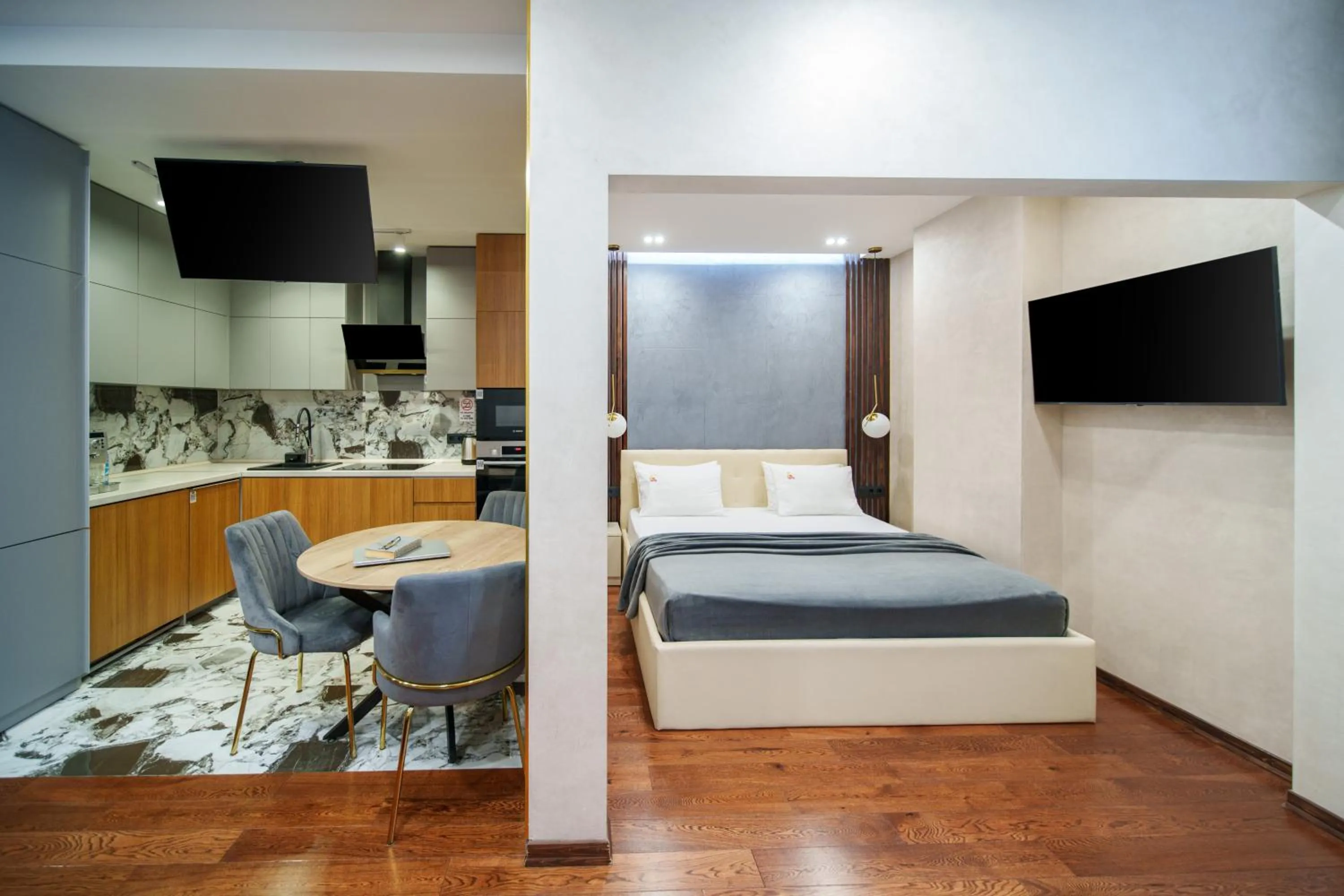 Bed in Arch Apart Hotel