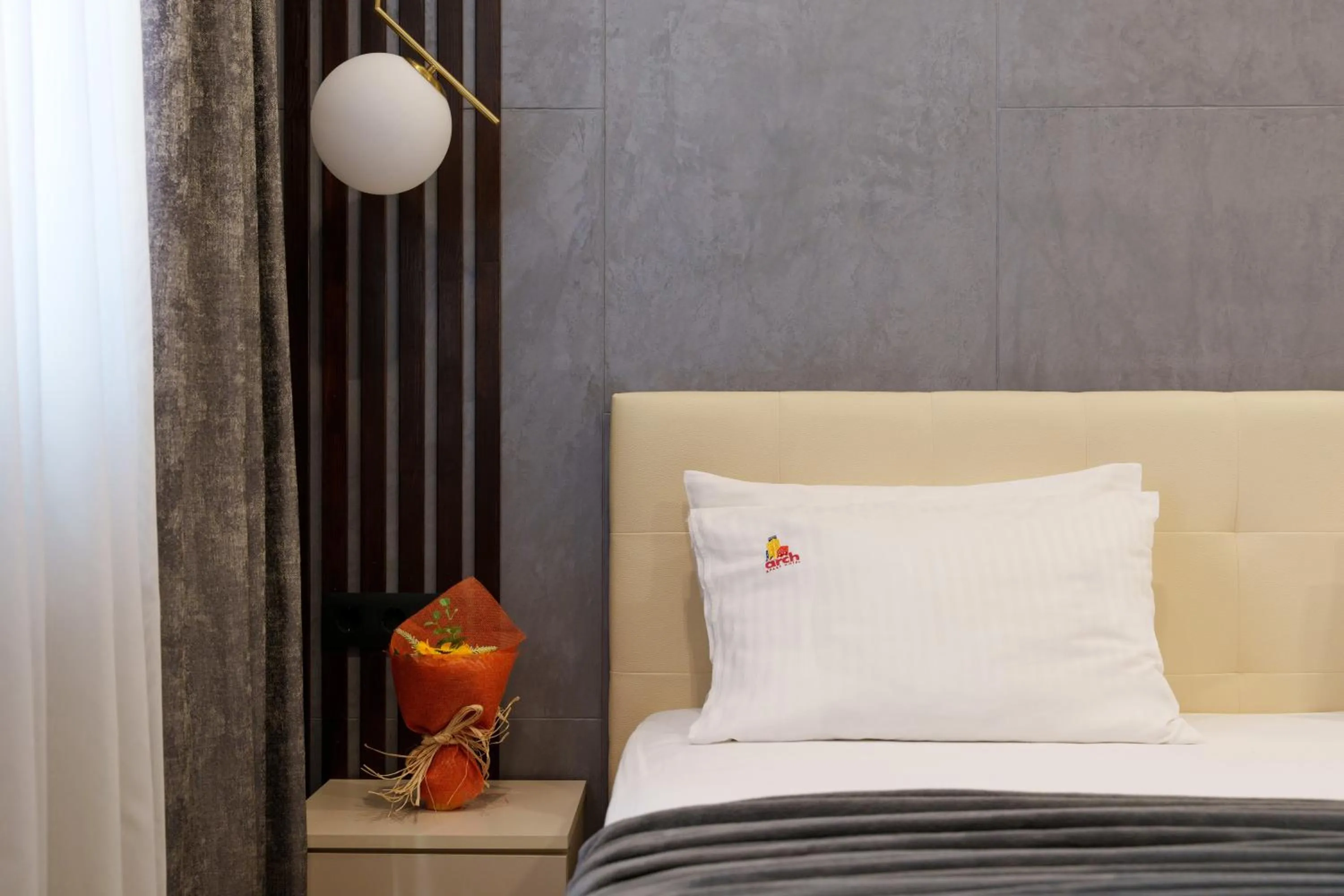 Bed in Arch Apart Hotel