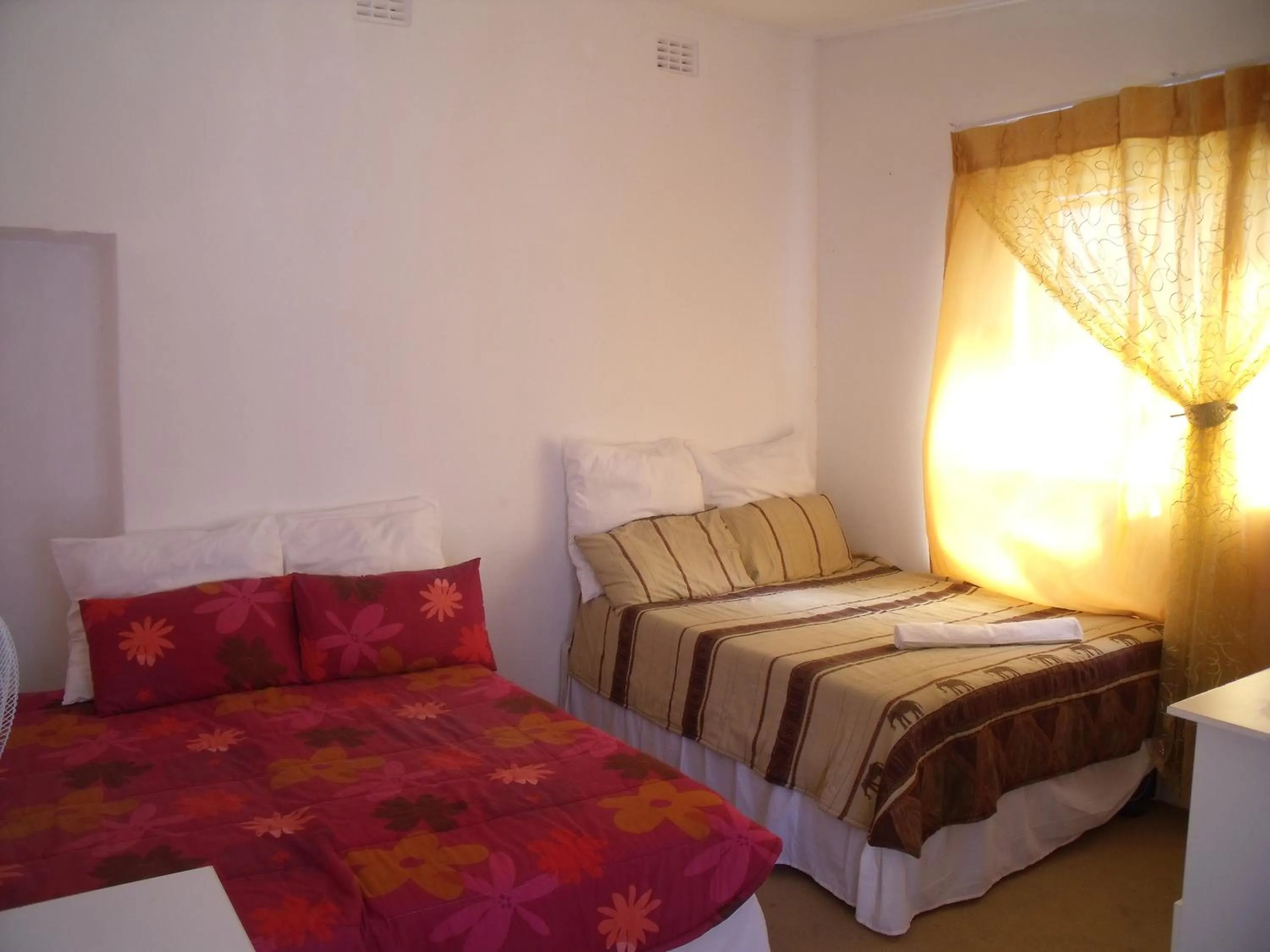 Bed in Rainbow Guesthouse