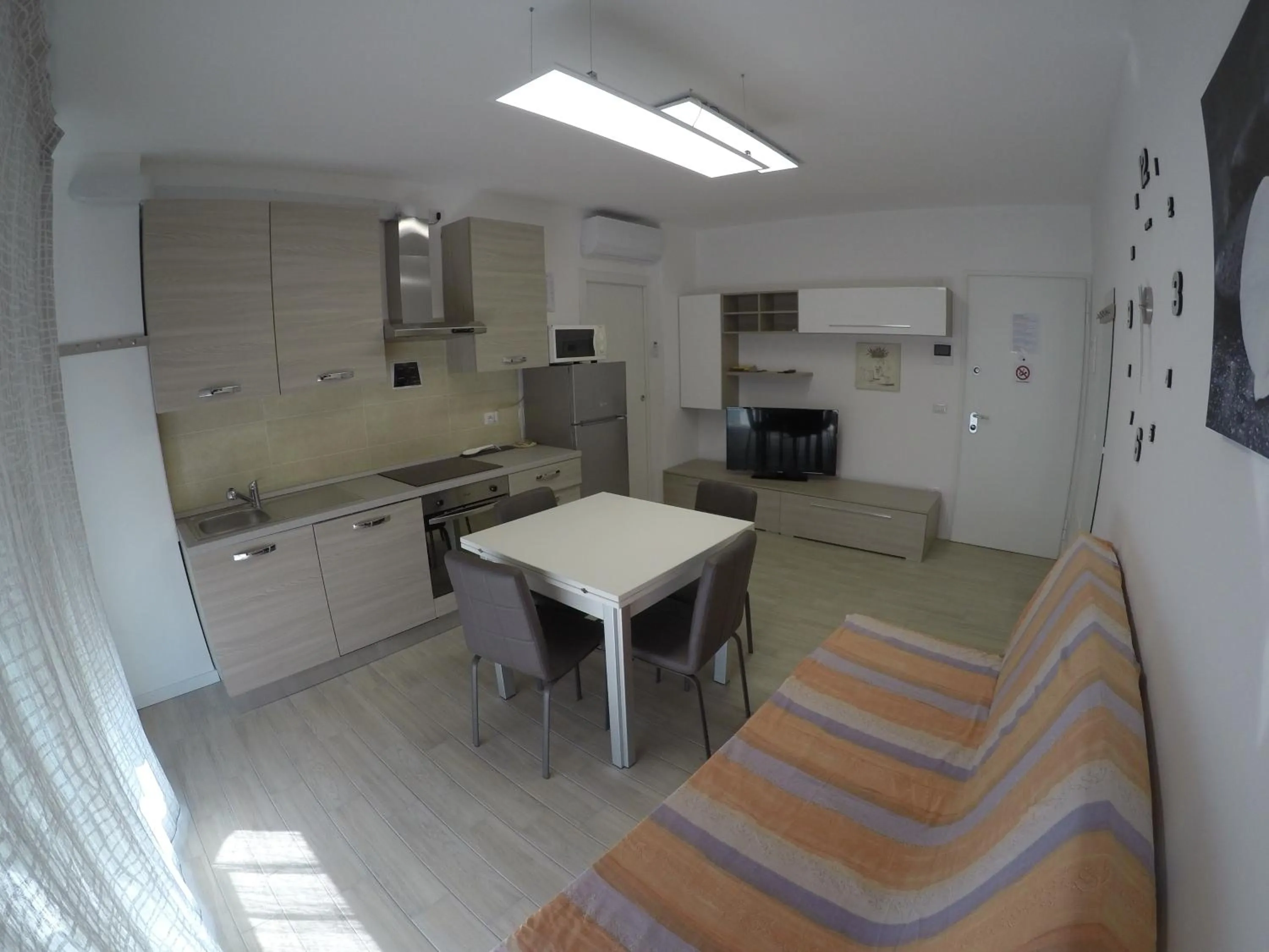 Kitchen or kitchenette in RESIDENCE CAORLE TRILOCALE CON PISCINA - Agenzia Cocal