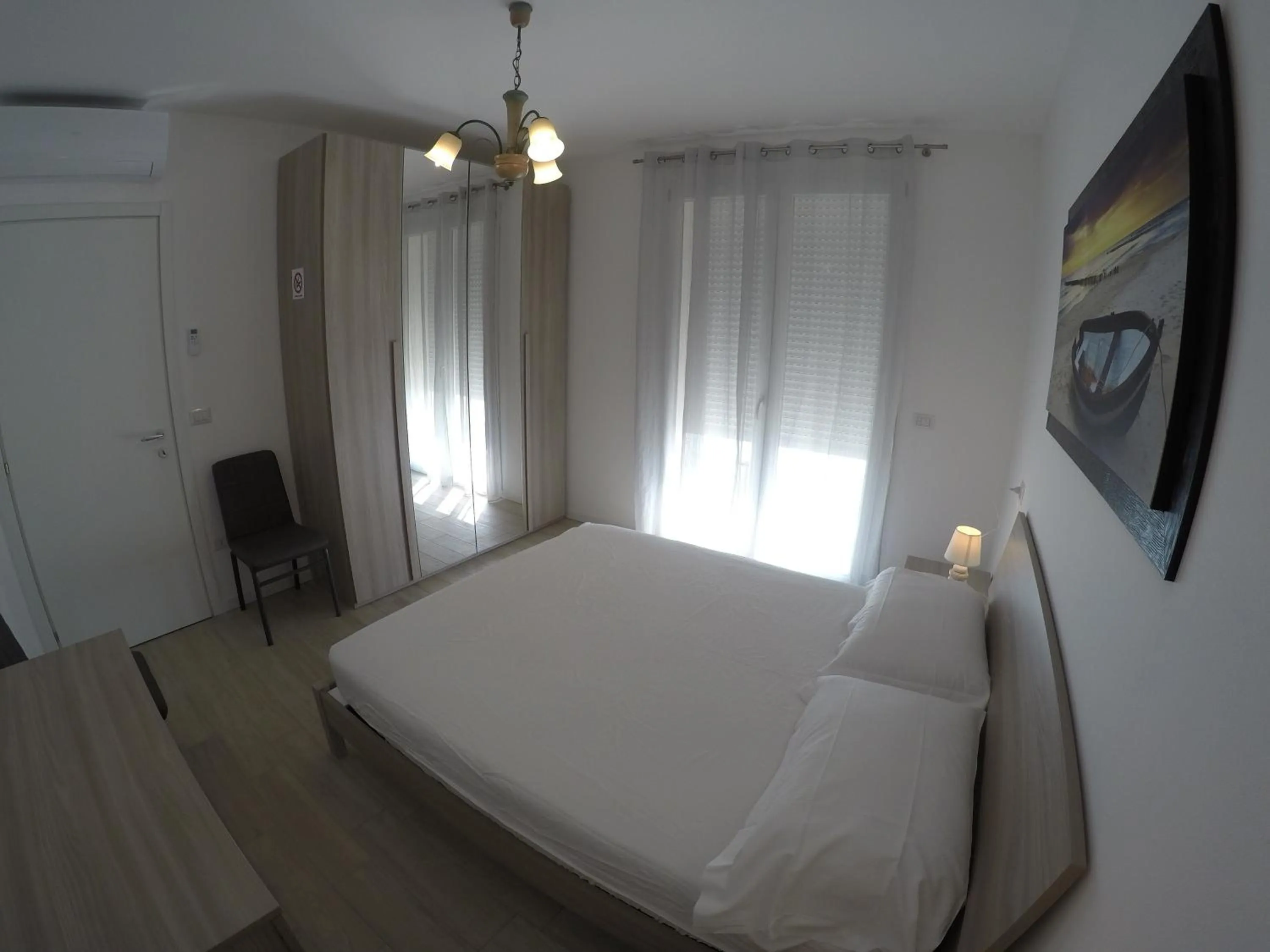 Bedroom, Bed in RESIDENCE CAORLE TRILOCALE CON PISCINA - Agenzia Cocal