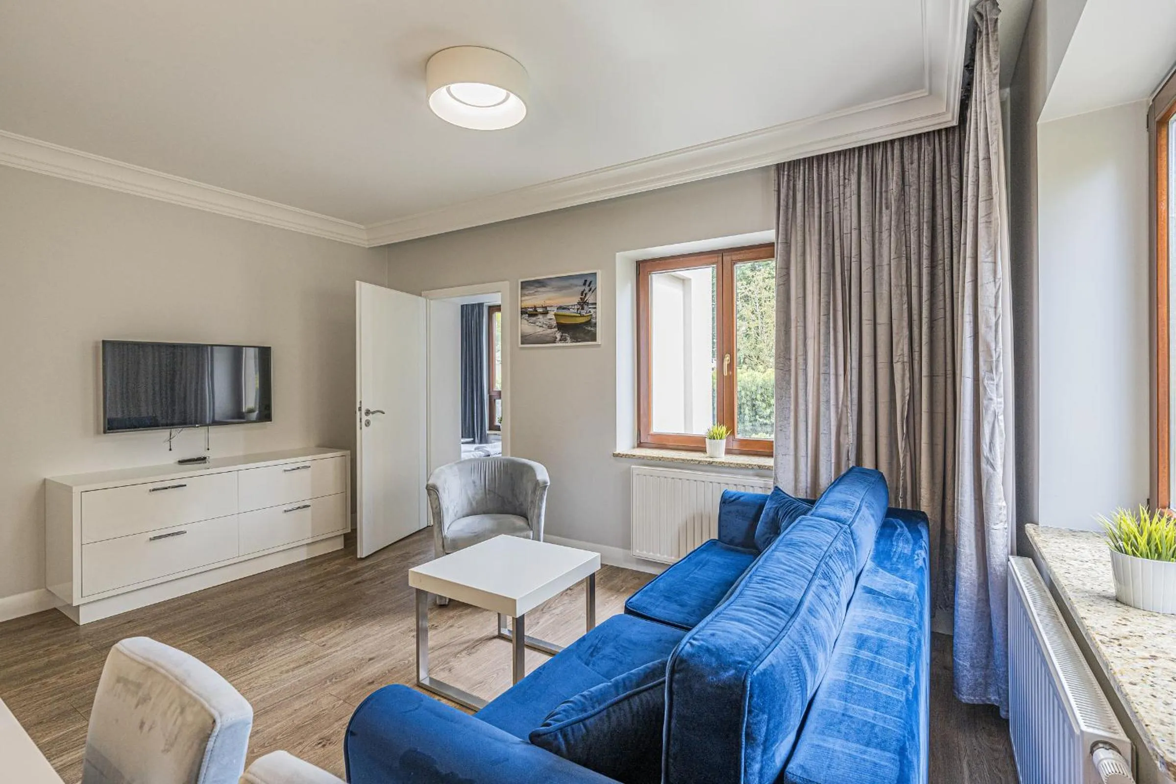 Communal lounge/ TV room in Apartamenty Martini