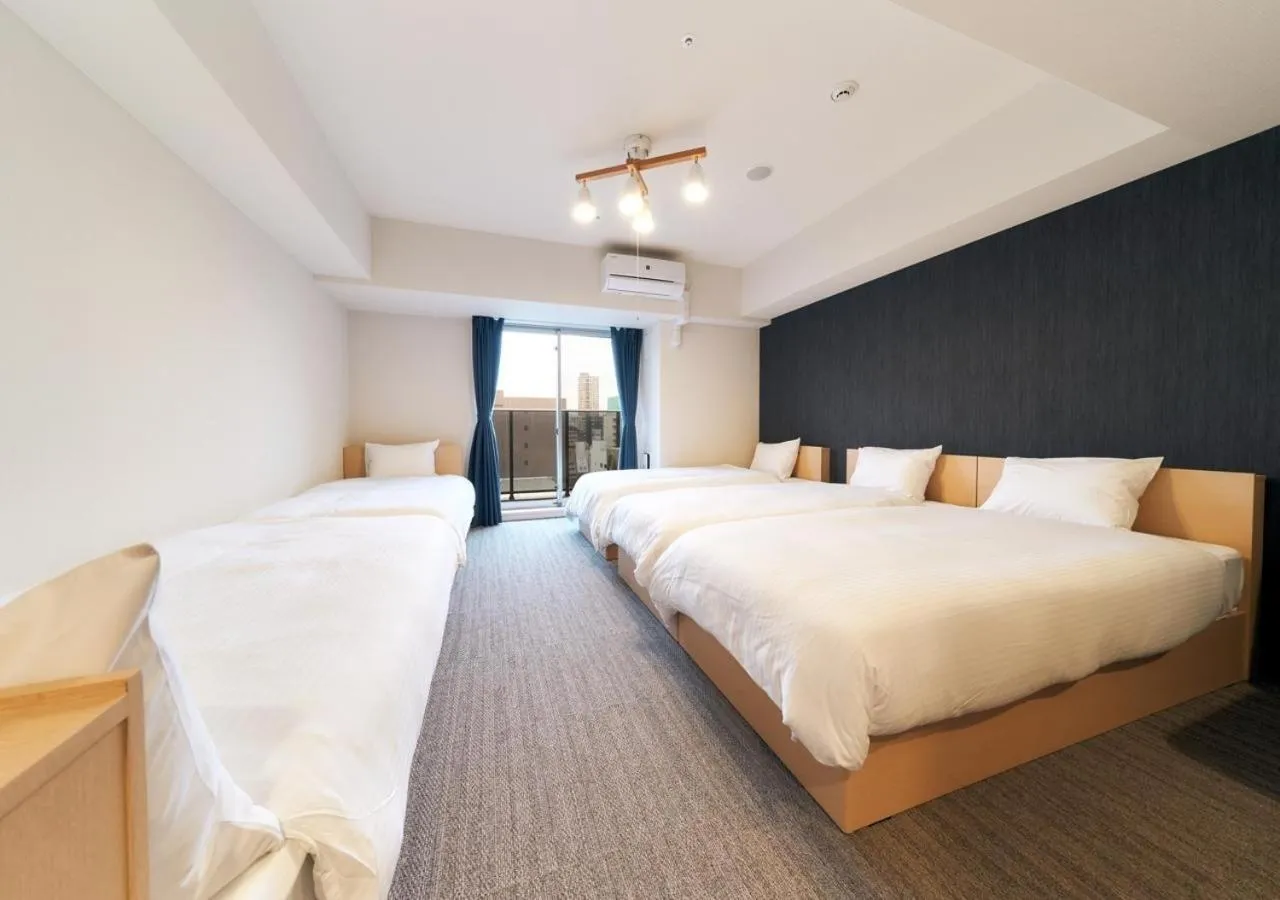 Bed in STAYAT OSAKA SHINSAIBASHI east - Family Room