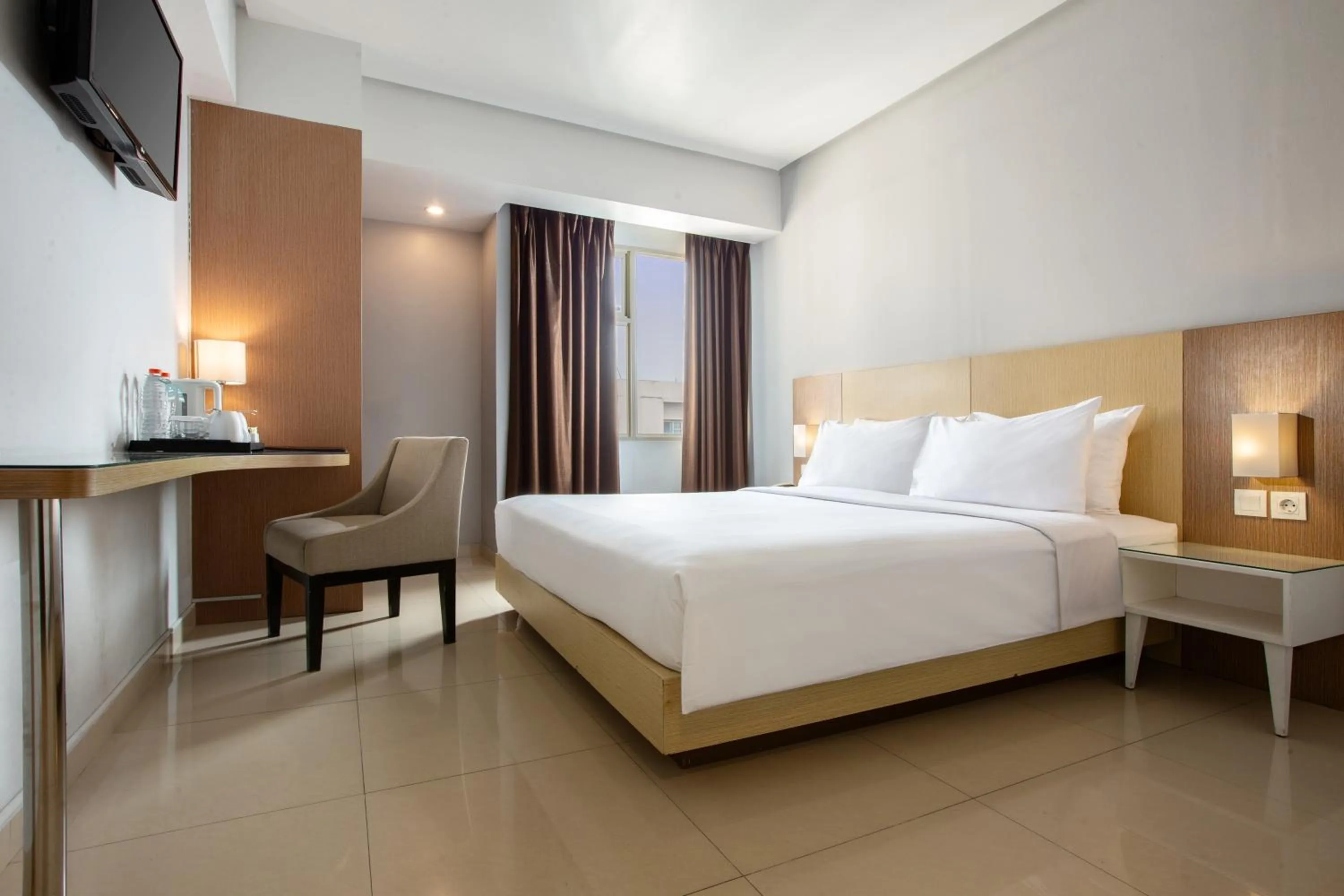 Photo of the whole room, Bed in Hotel Santika Depok
