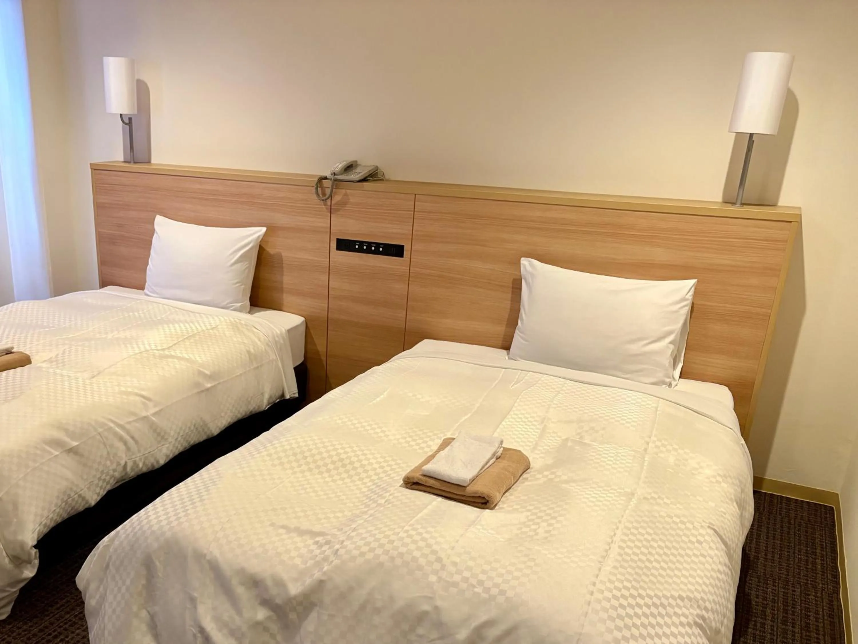 Bed in Amakusa Onsen Hotel Shikisakikan