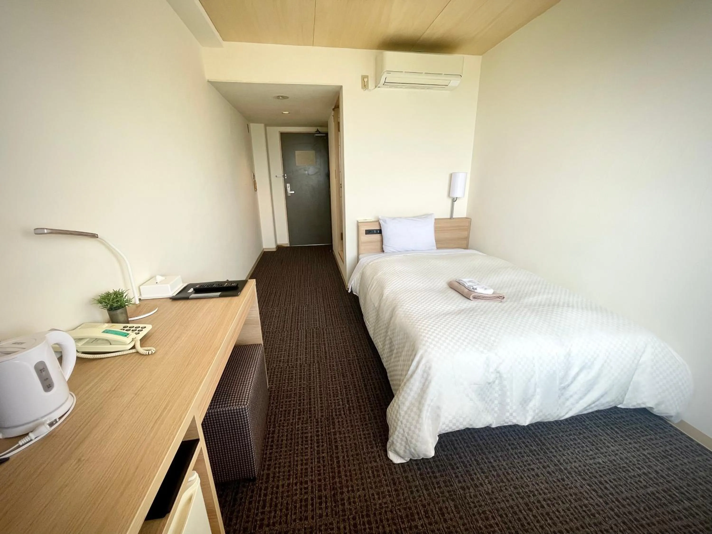 Bed in Amakusa Onsen Hotel Shikisakikan