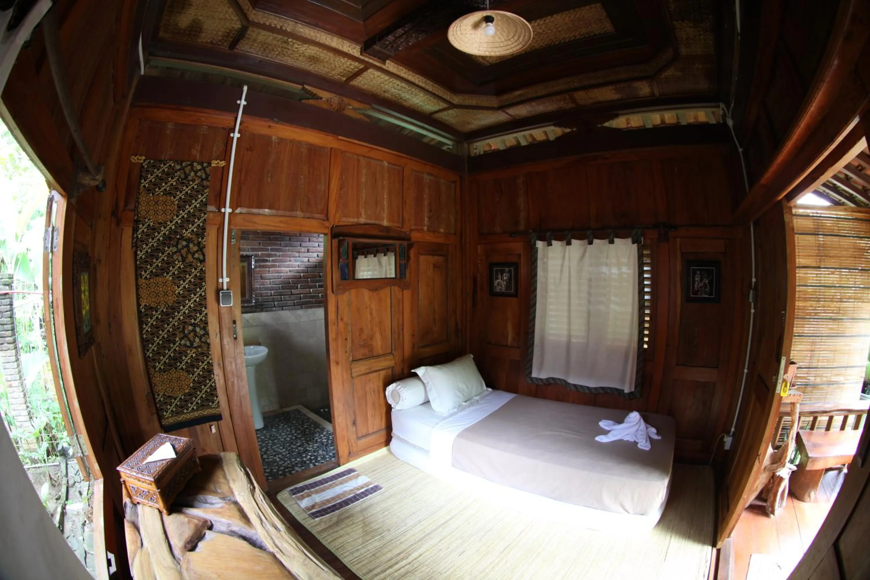 Bed in Omah Garengpoeng Guest House