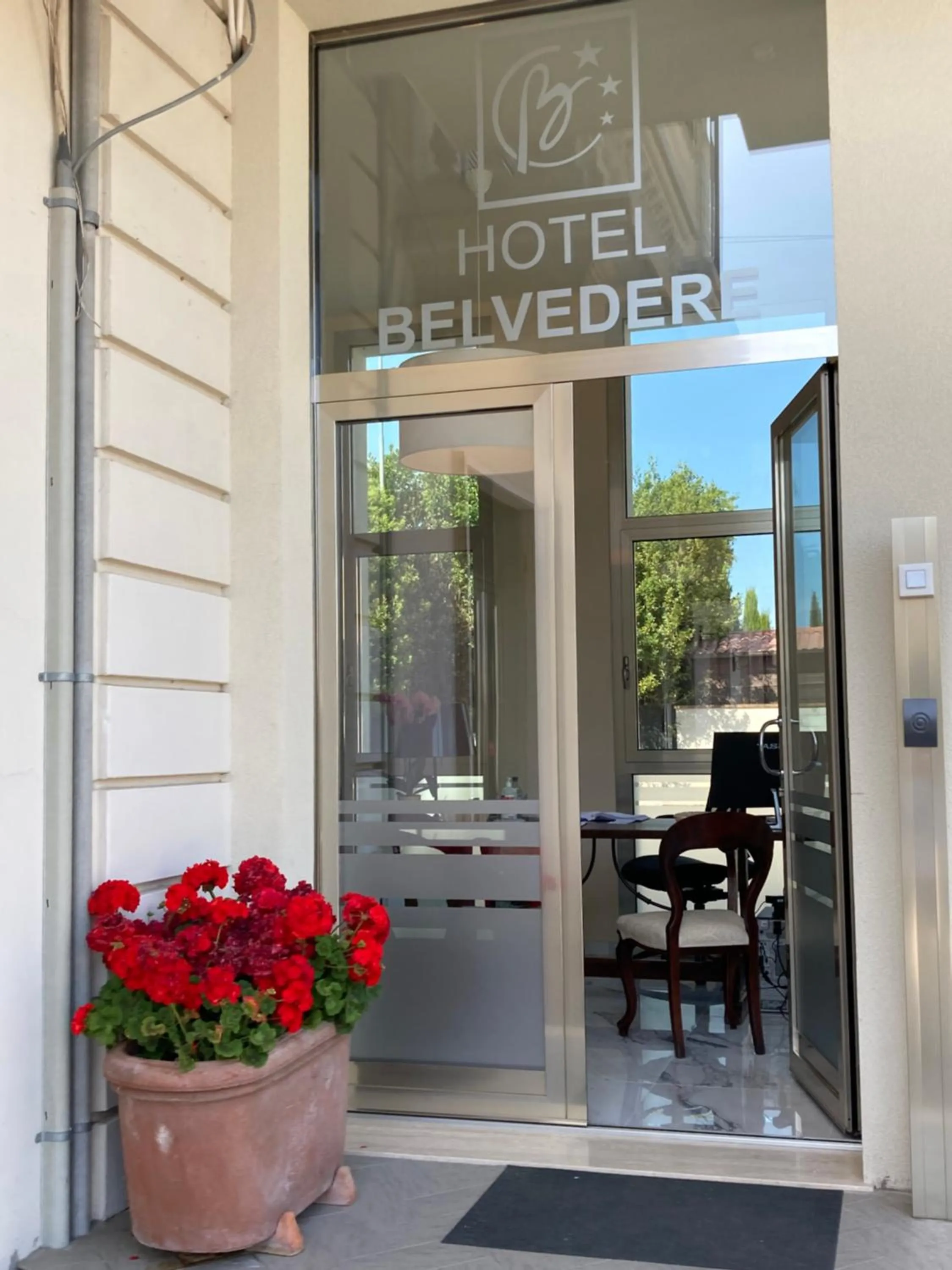 Property logo or sign in Hotel Belvedere
