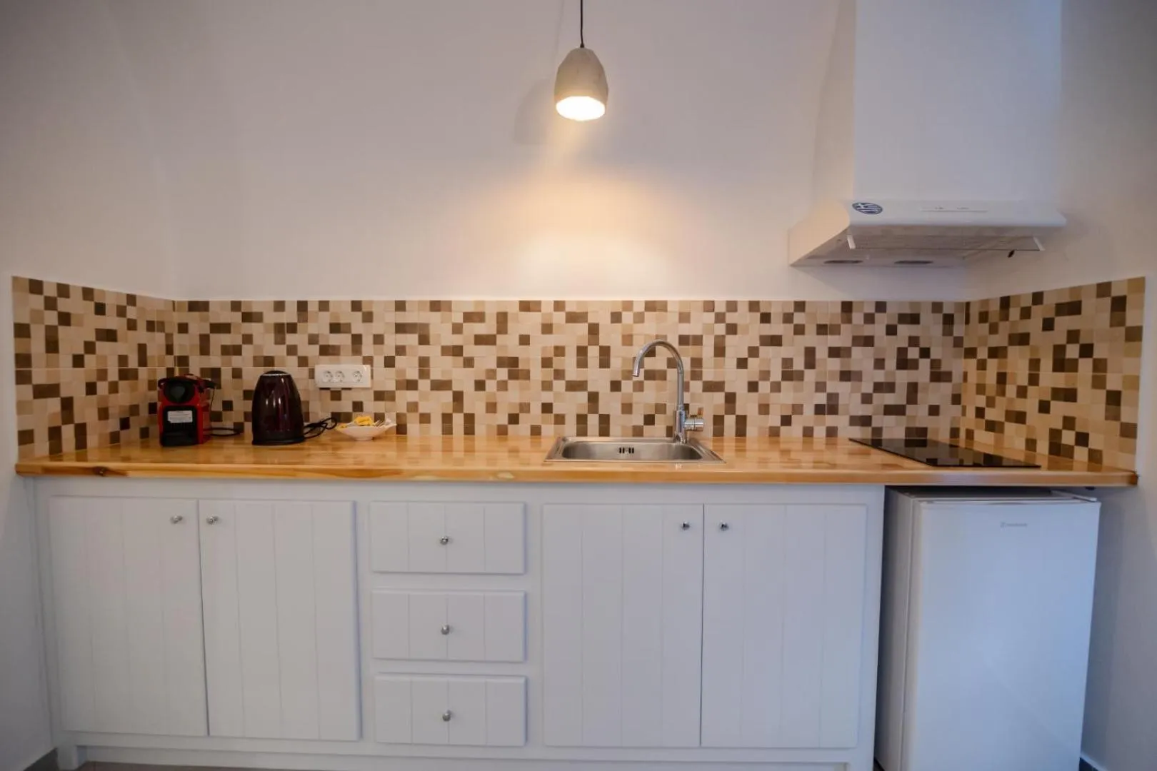 kitchen in Sun Angelos Oia - Luxury Cave Suites