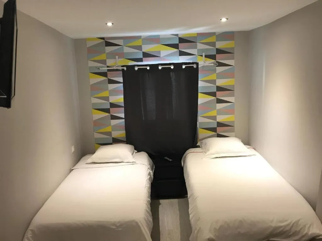 Bed in Hôtel Beauséjour