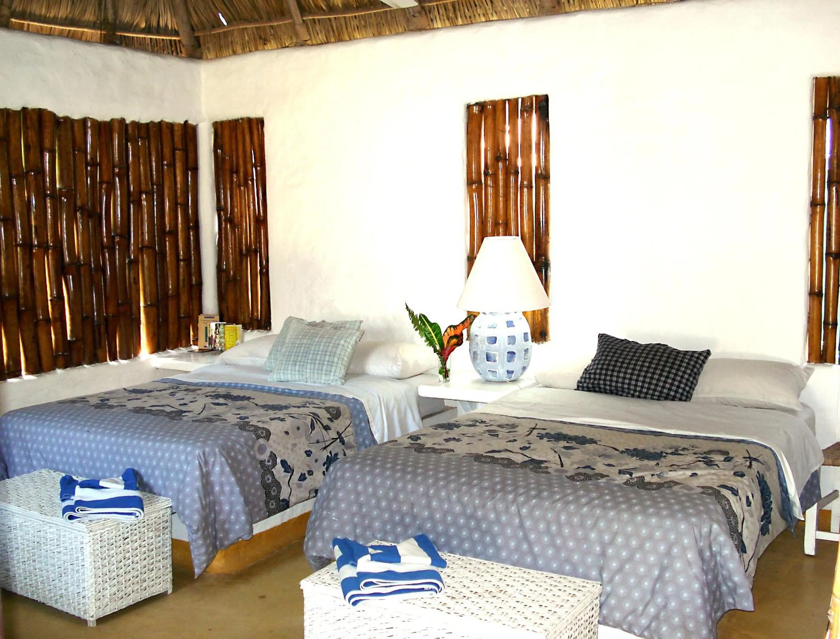 Bed in Junto al Rio Bungalows & Suites