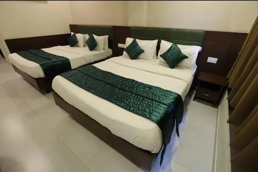 Bed in Greenotel Rooms Hazira, Surat