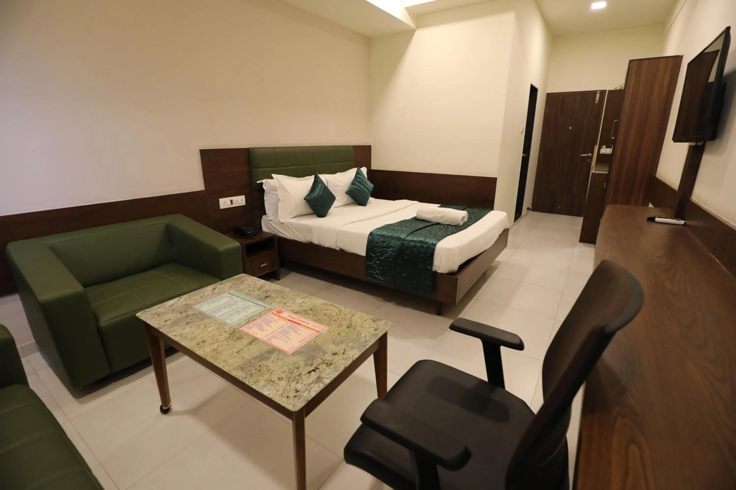 Bed in Greenotel Rooms Hazira, Surat