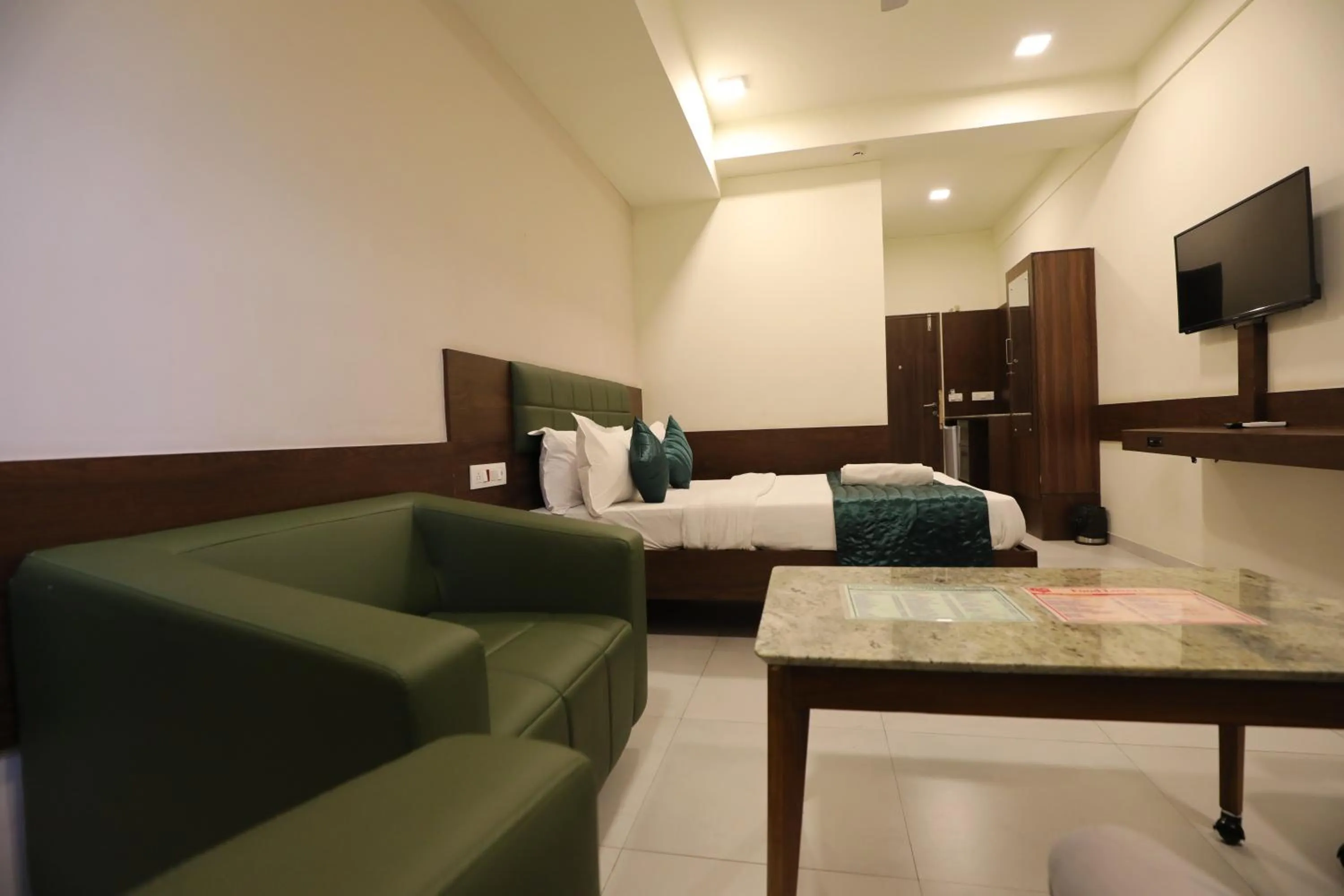 Bed in Greenotel Rooms Hazira, Surat
