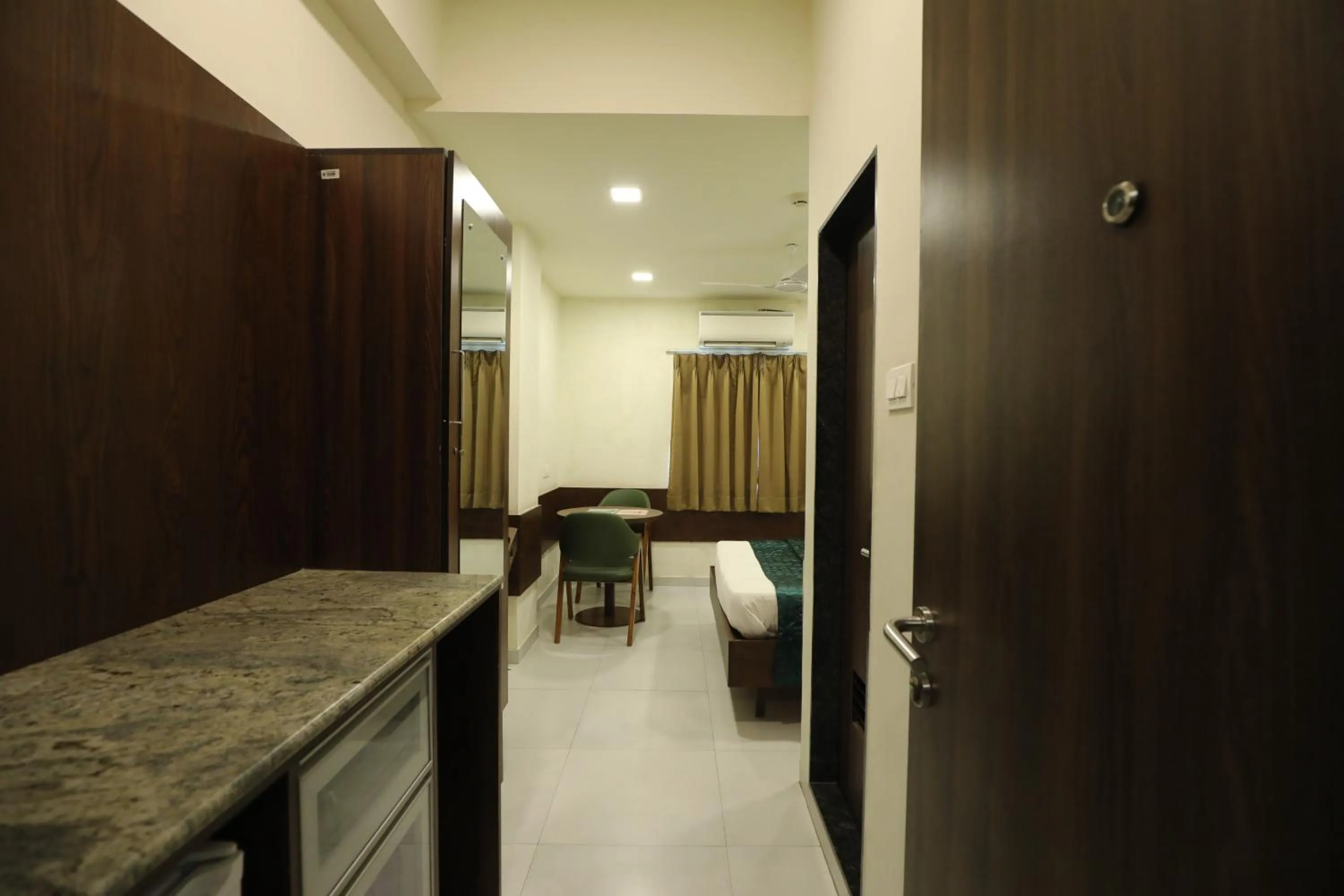 Kitchen or kitchenette in Greenotel Rooms Hazira, Surat