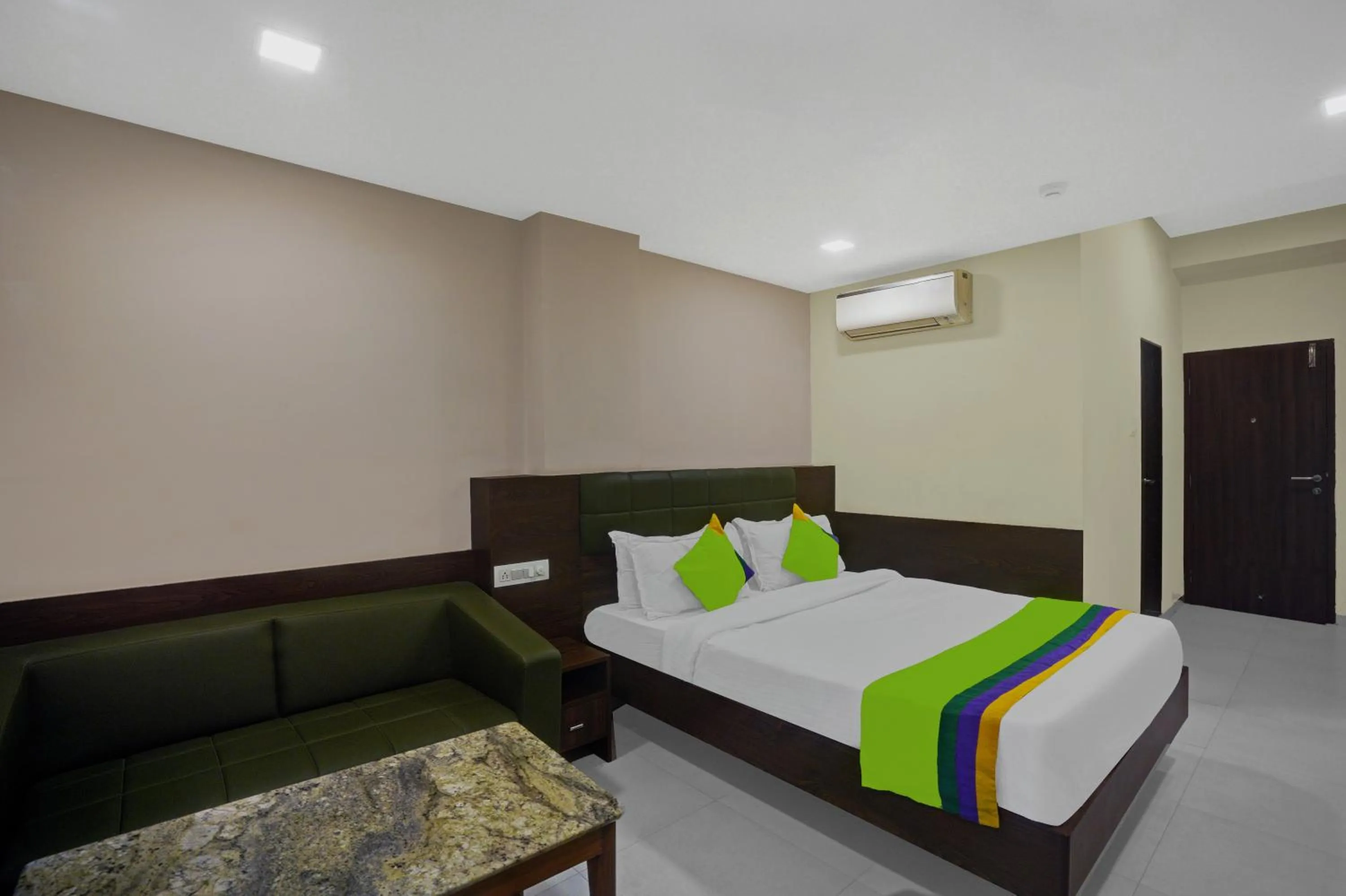 Bed in Greenotel Rooms Hazira, Surat